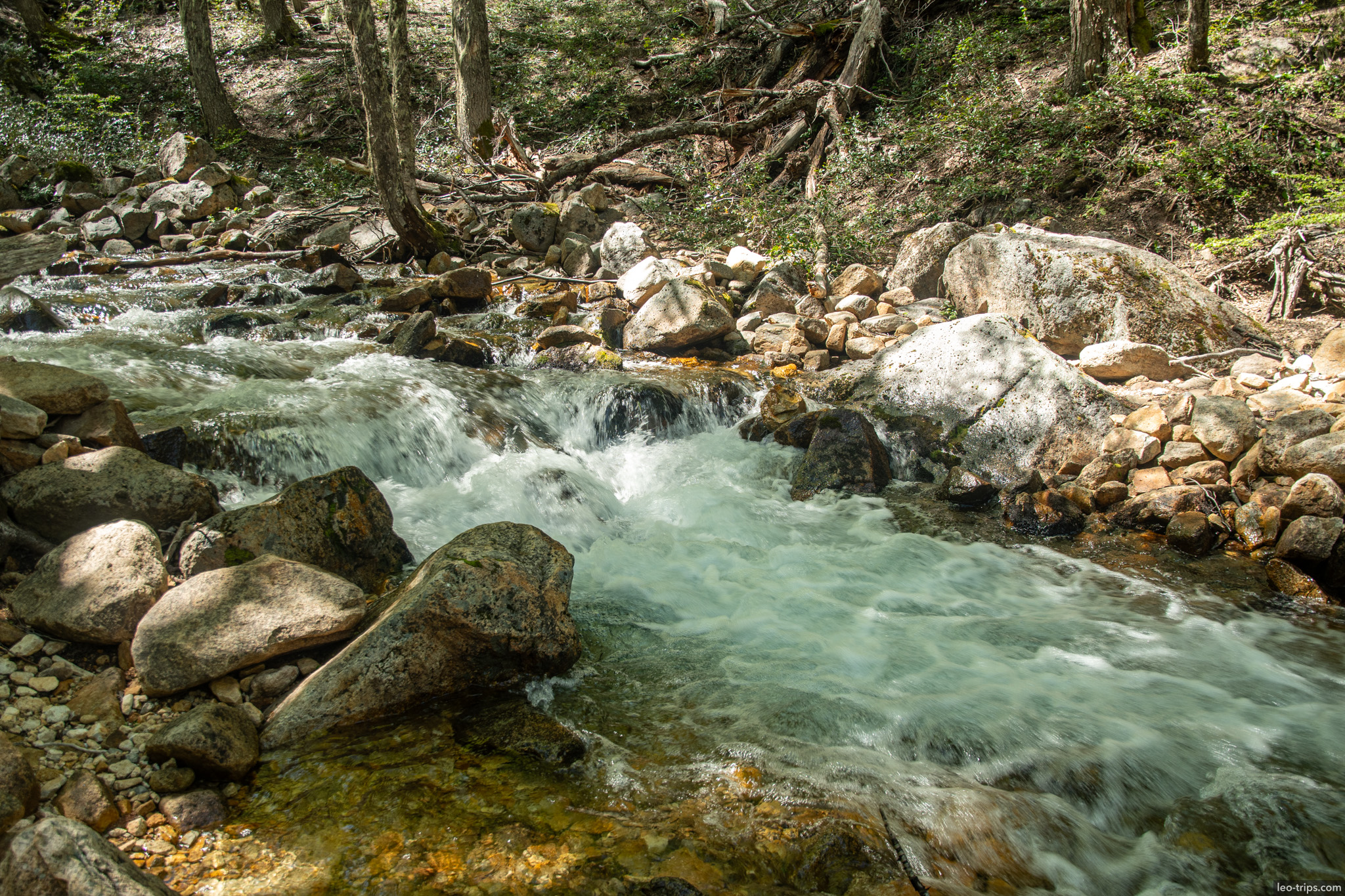 clear mountain stream over boulders frey refuge trail