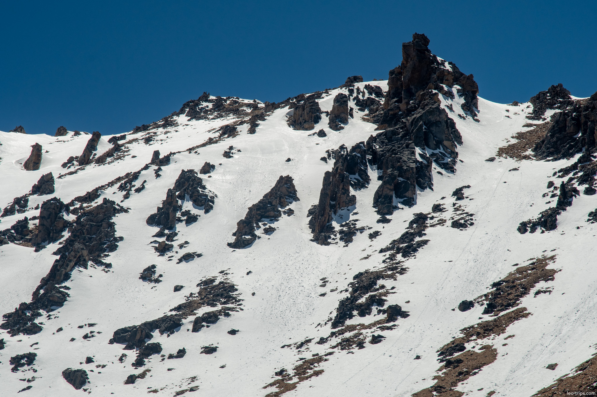 jagged rock spires snowy ridge frey refuge trail