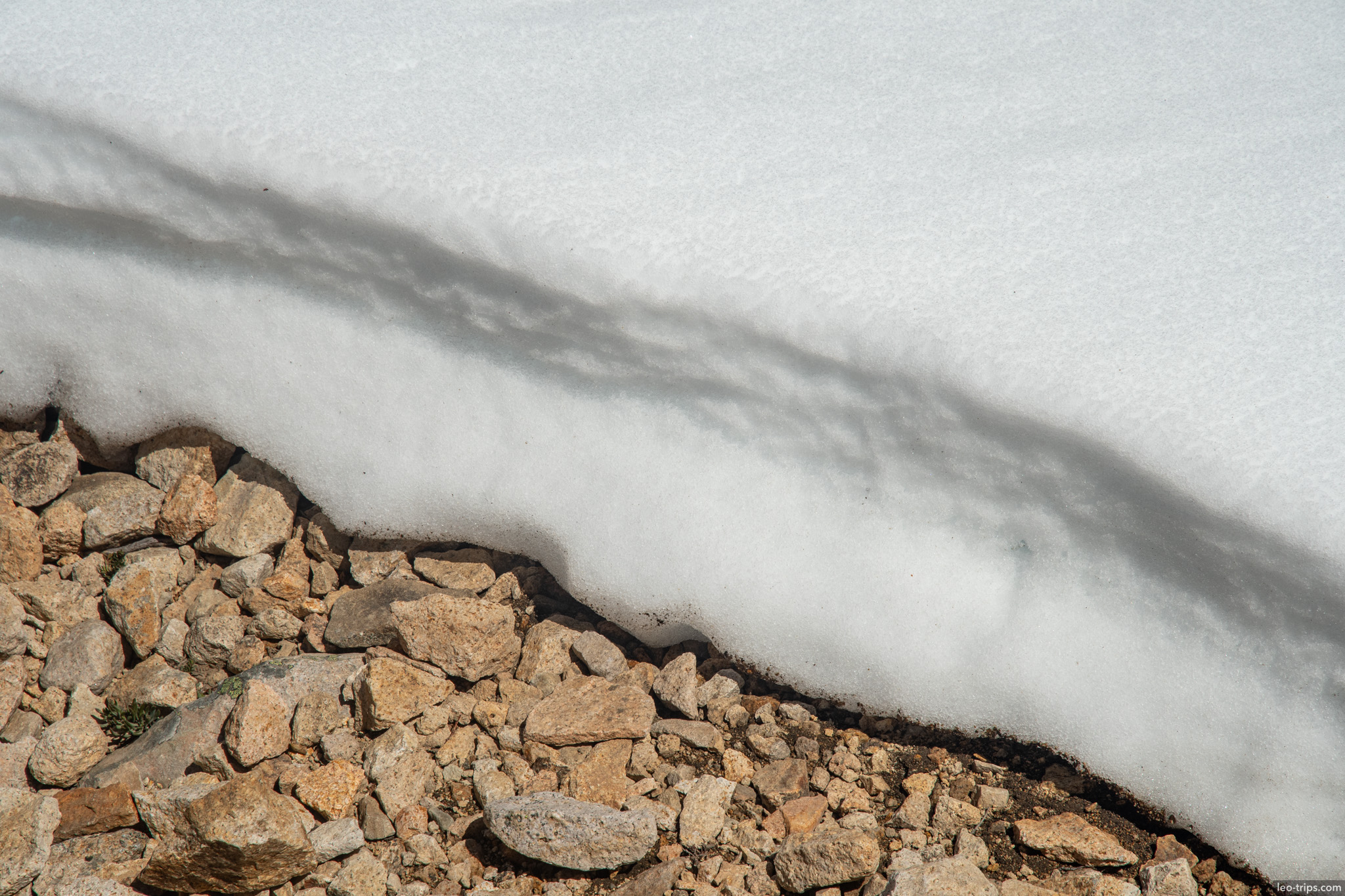 snow edge over rocky ground frey refuge trail