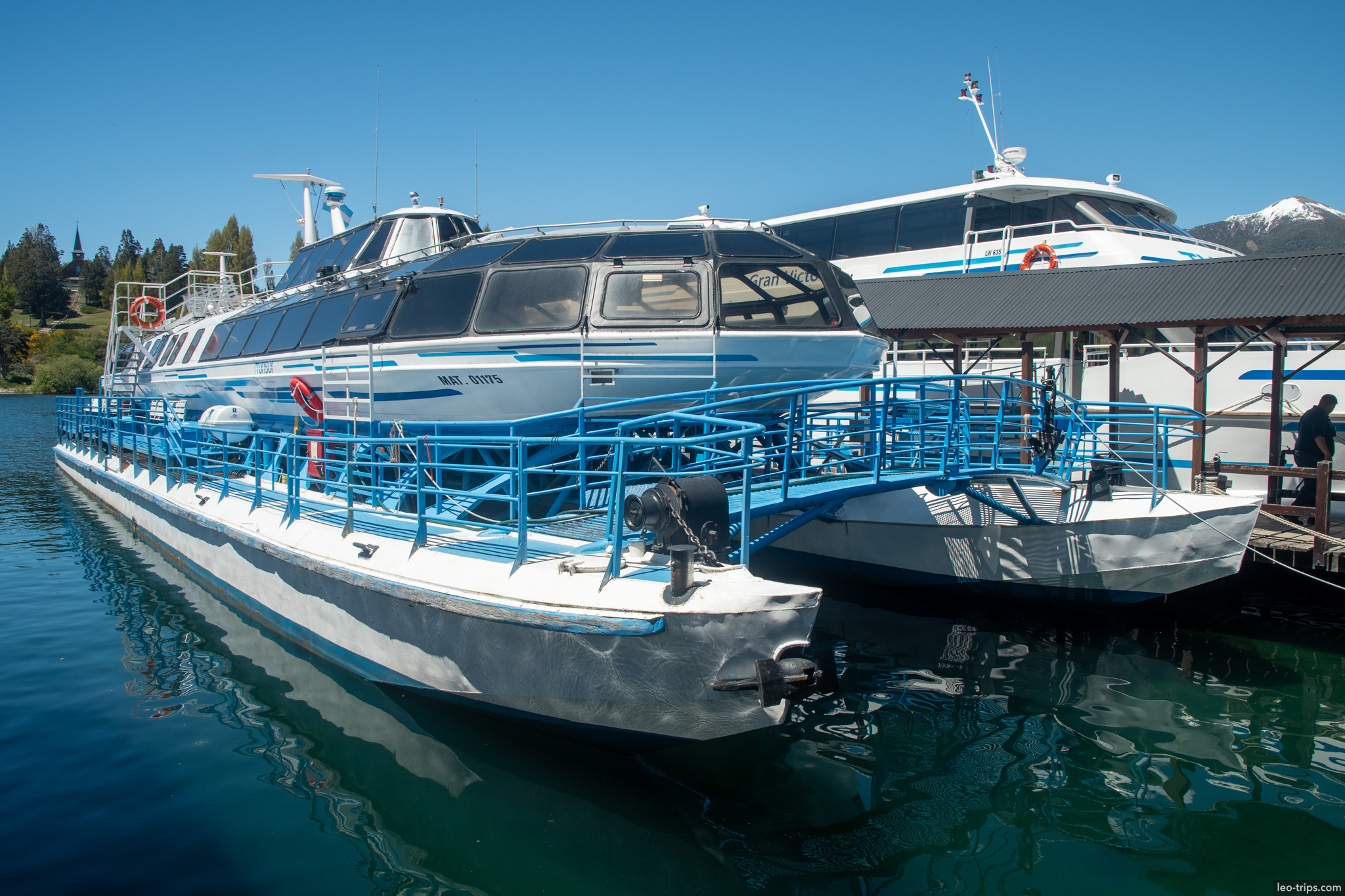 blue white catamaran boats docked puerto blest