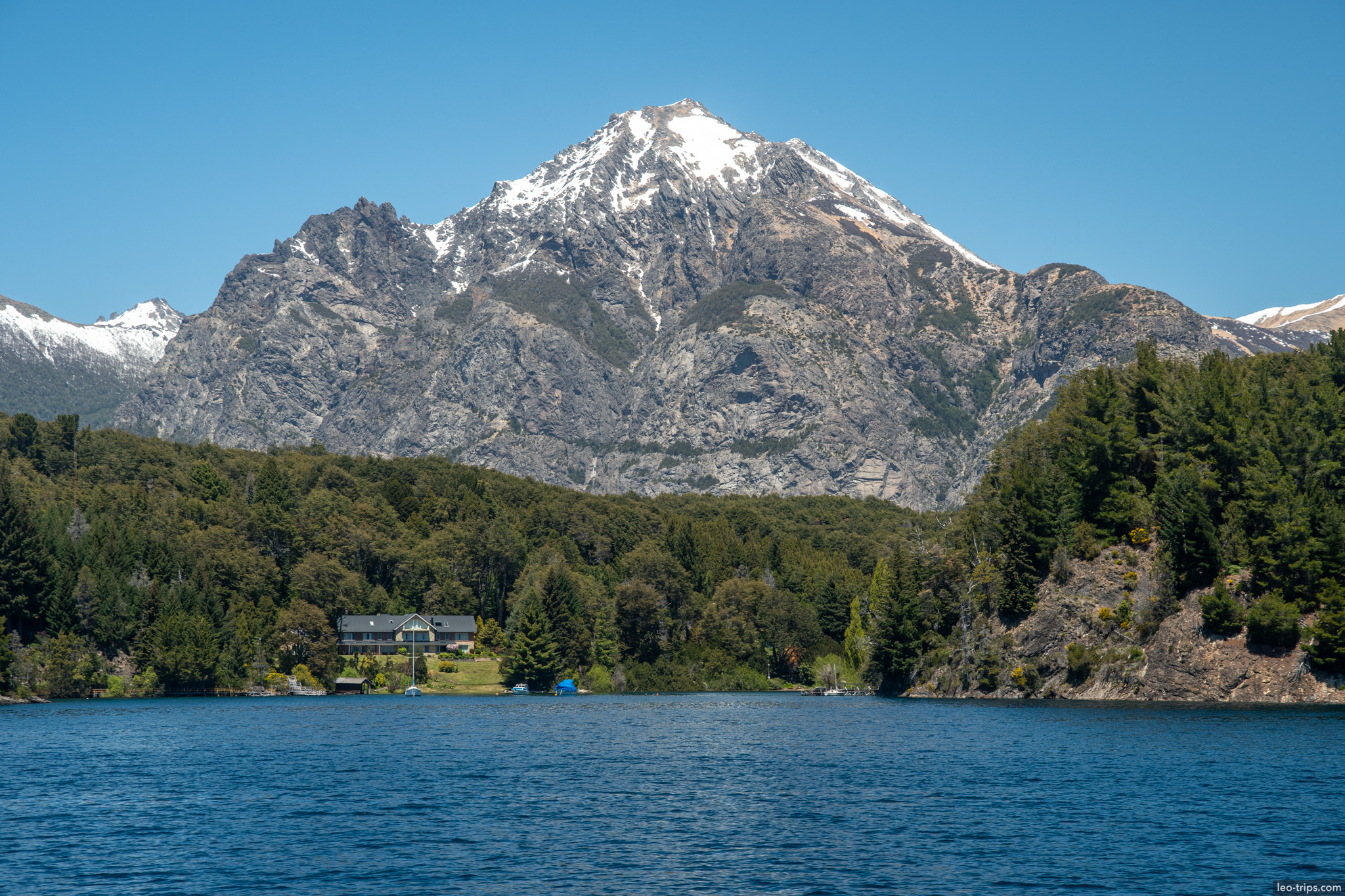 lakeside lodge below snowy peak puerto blest