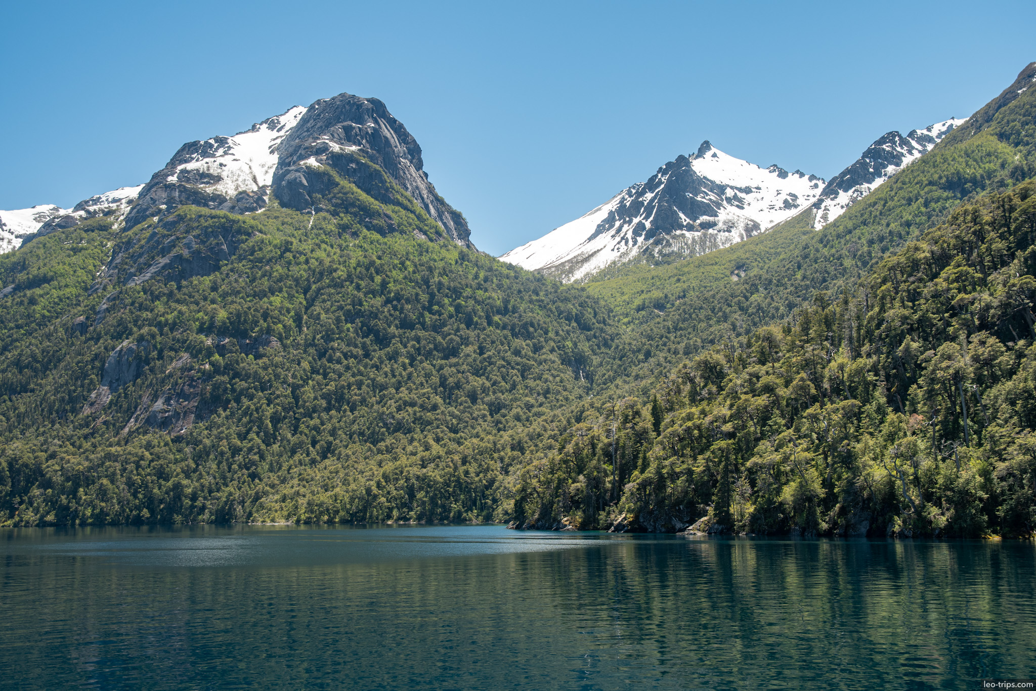 twin snowy peaks over lake puerto blest