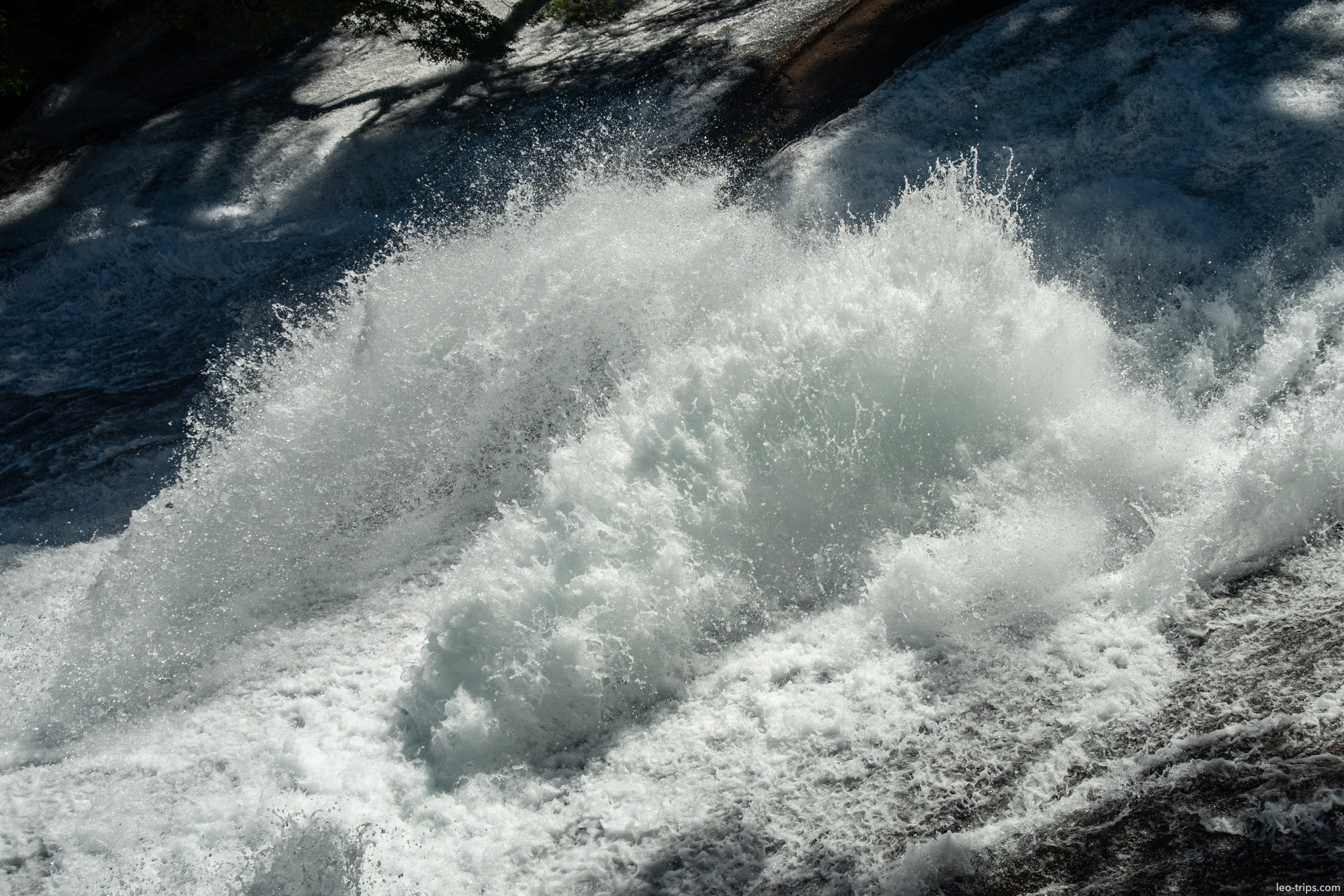 waterfall crashing over dark rocks puerto blest