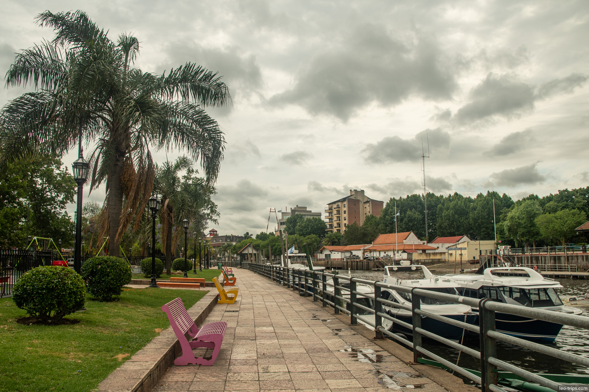 riverside promenade colorful benches boats tigre
