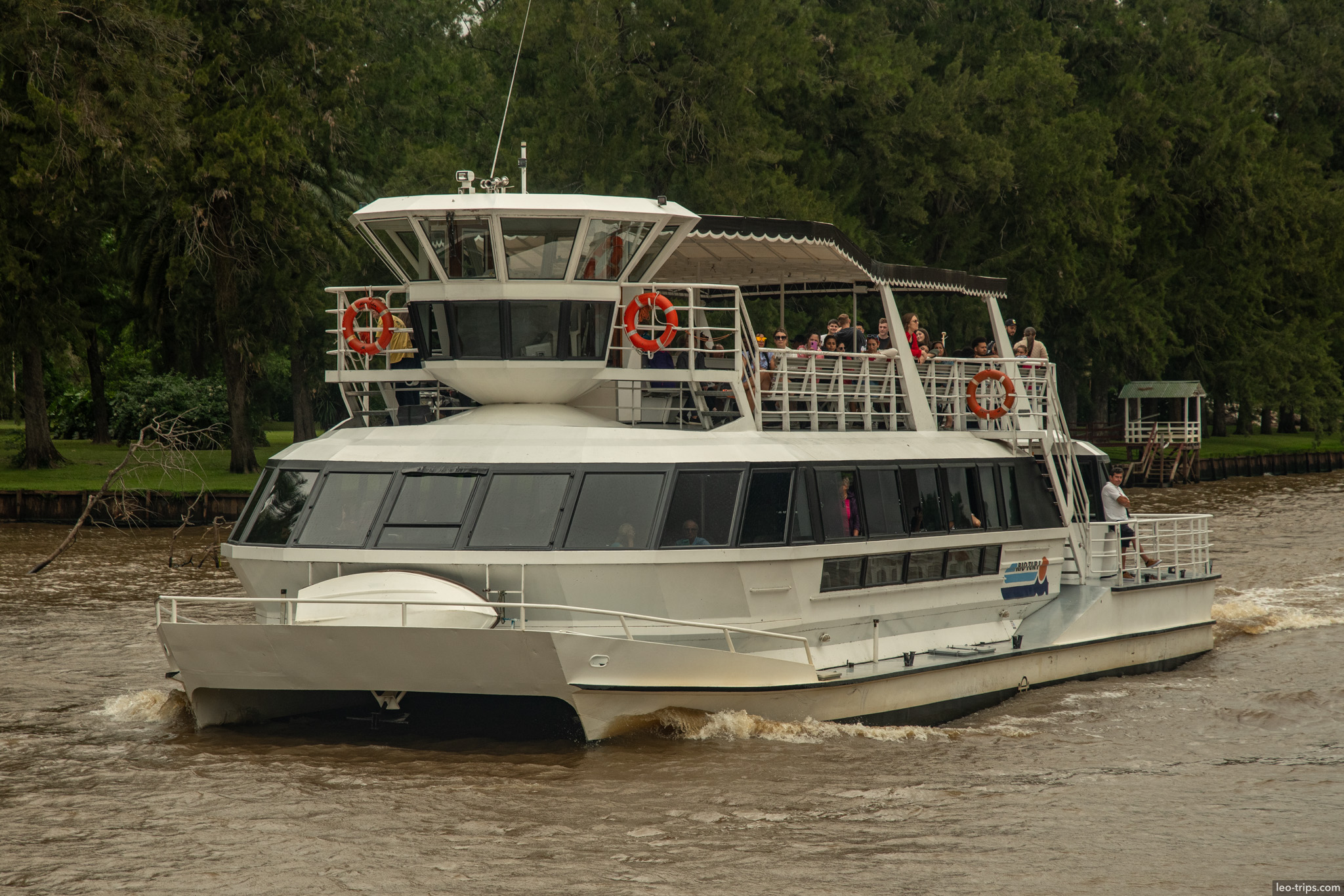 white catamaran passenger boat approaching tigre