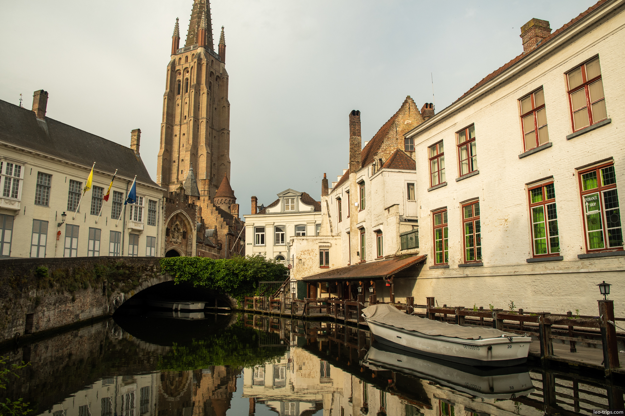 bruges canal onze lieve vrouwekerk tower boat bruges