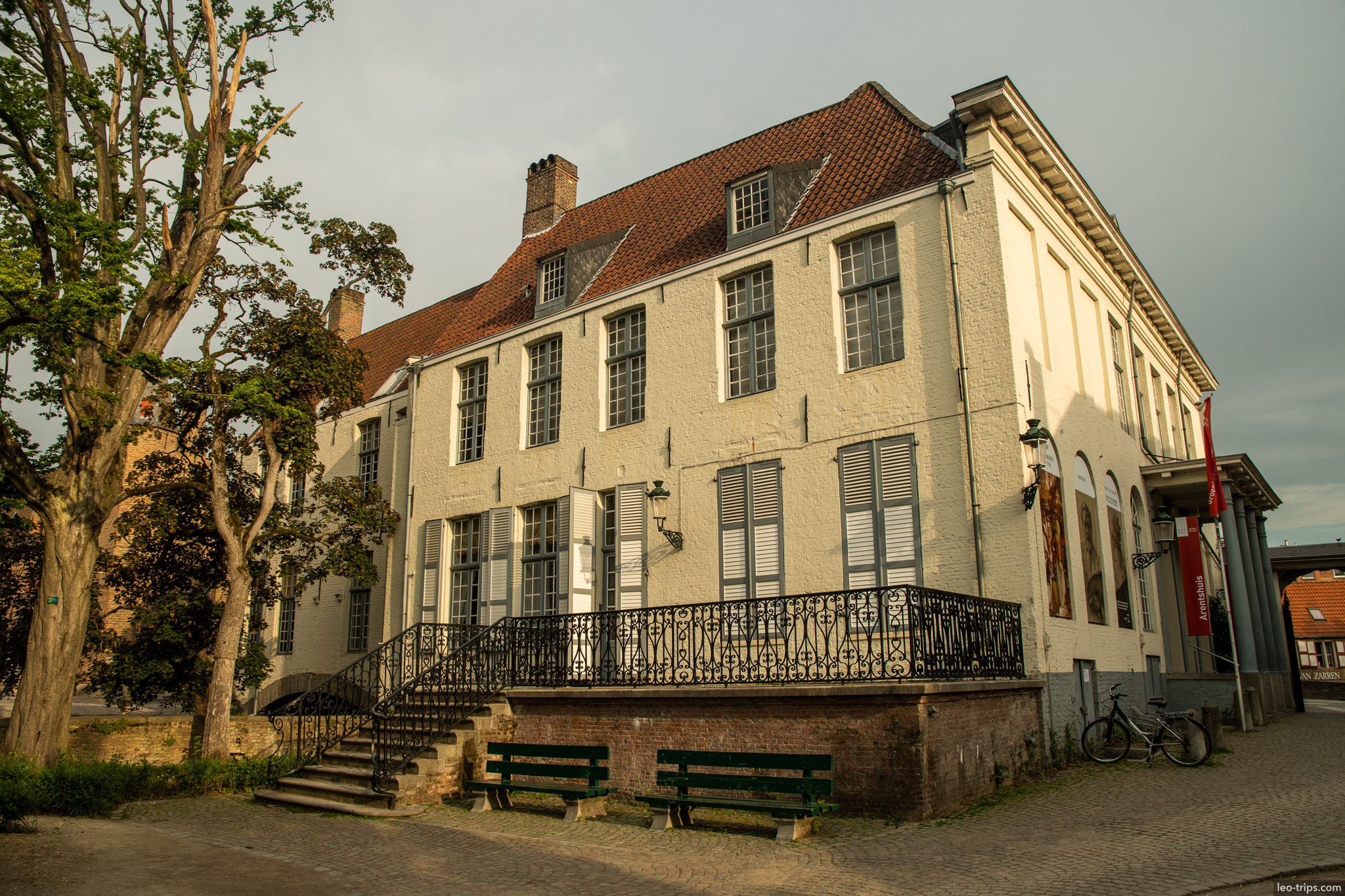 bruges white historic building wrought iron balcony bruges
