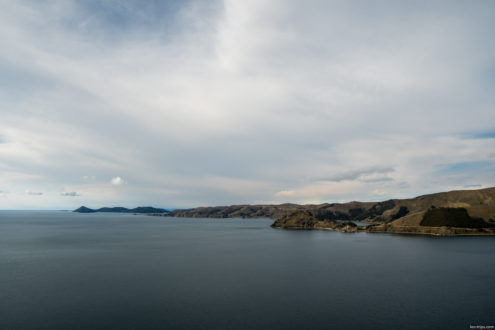 lake titicaca calm waters hills copacabana