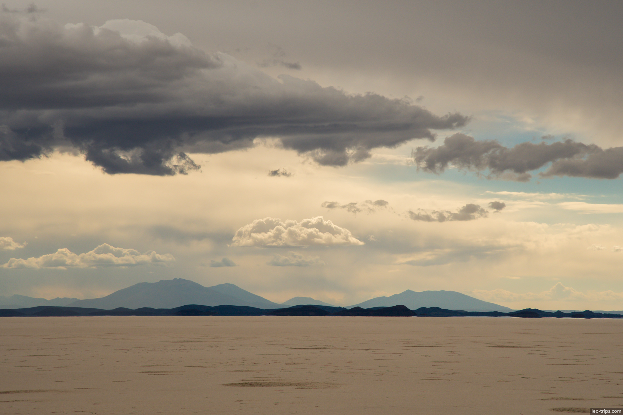 salar de uyuni mountain silhouette storm clouds salar de uyuni