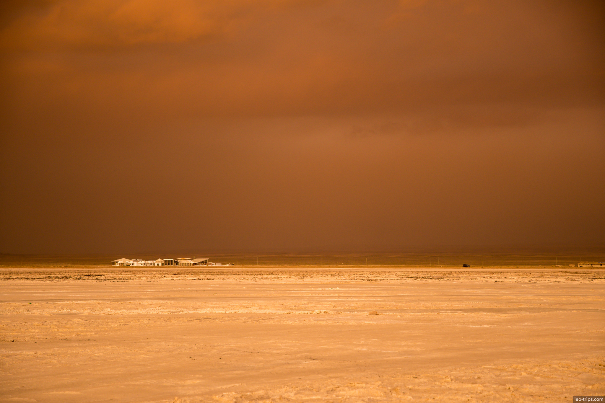 salar de uyuni orange storm sky building salar de uyuni