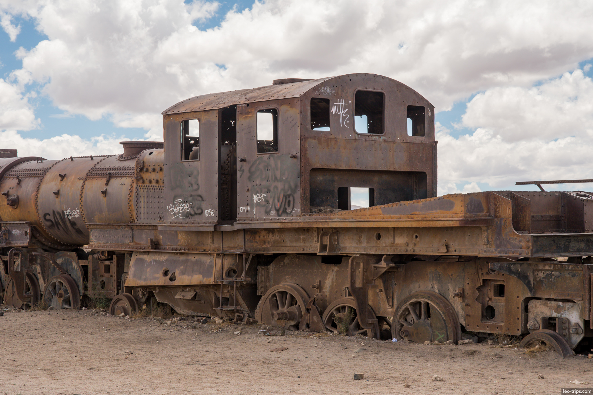uyuni train cemetery rusted locomotive cab graffiti salar de uyuni