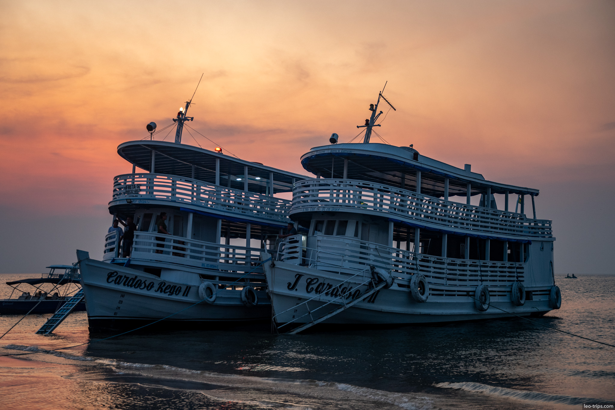 amazon river boats at sunset alter do chao