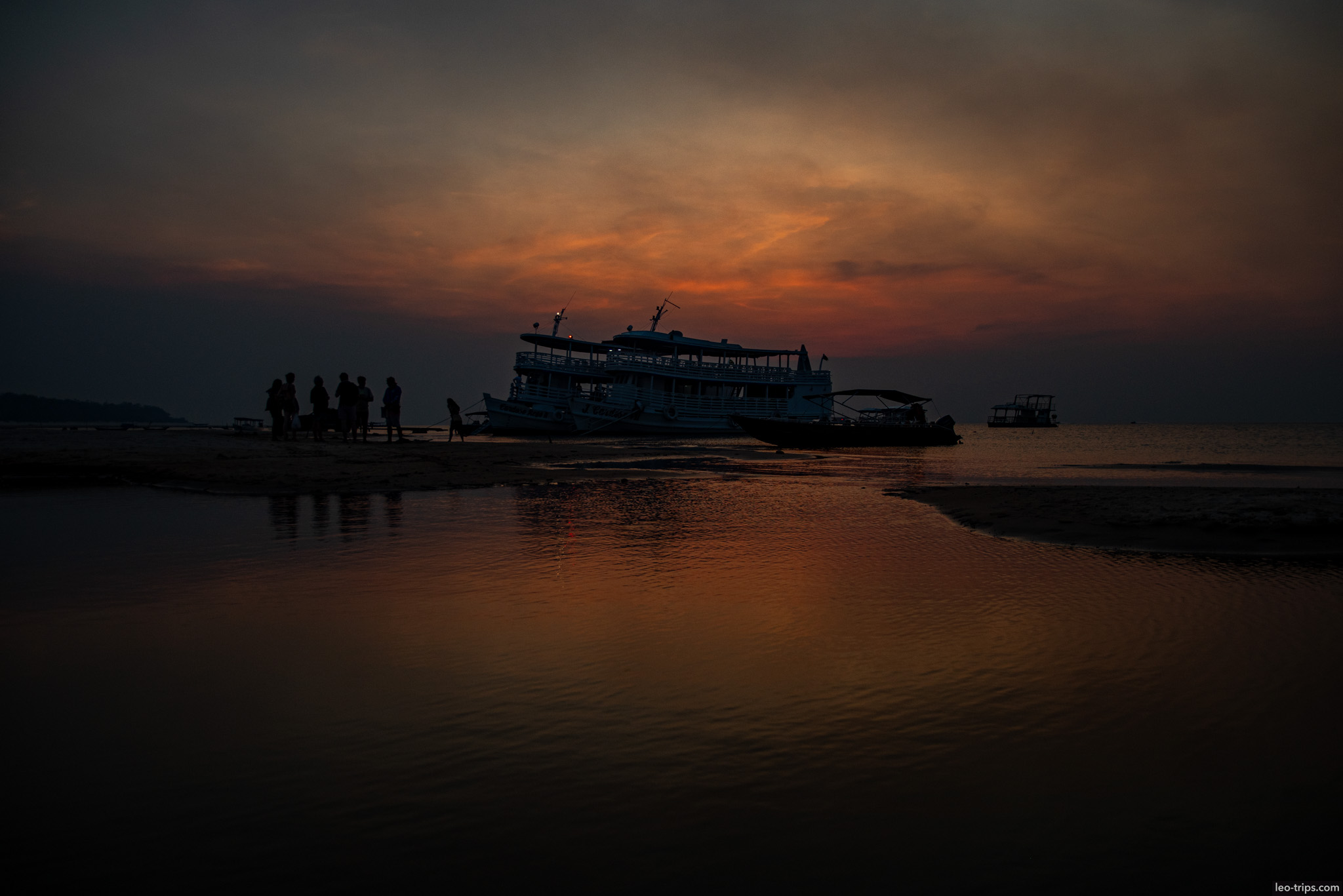 dramatic sunset boat silhouette alter do chao