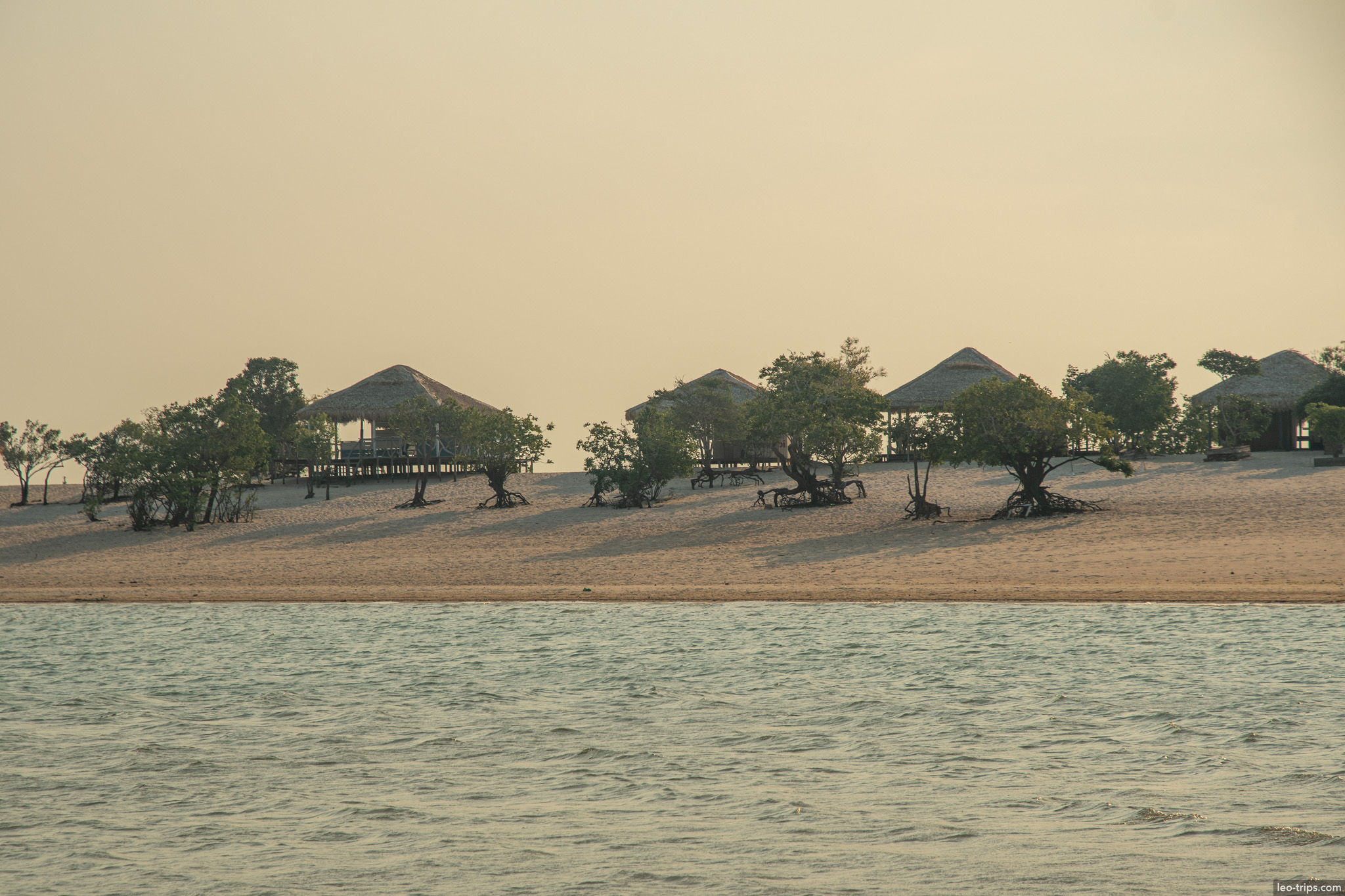island thatched huts sunset alter do chao