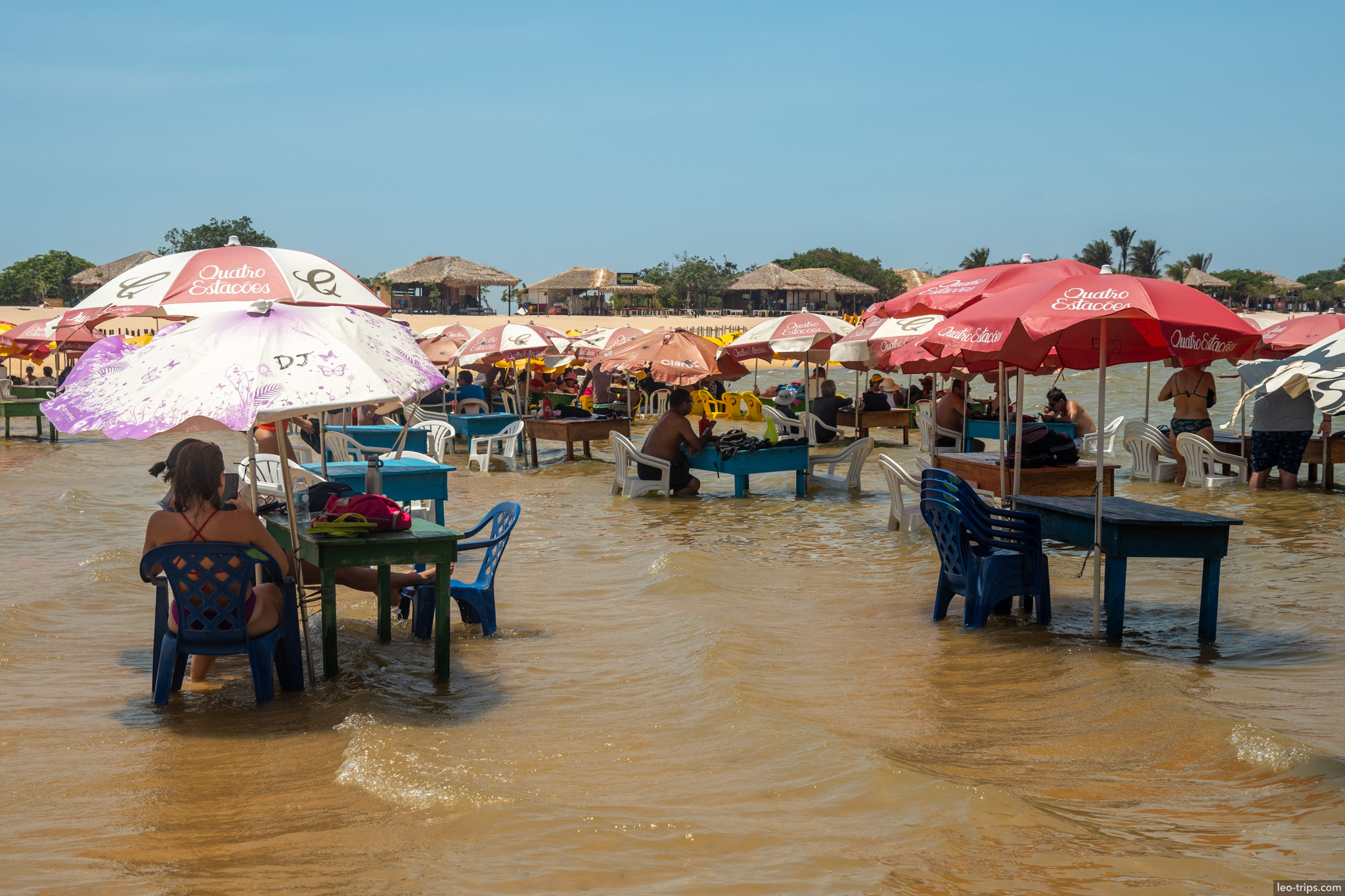 pink umbrellas beach dining alter do chao