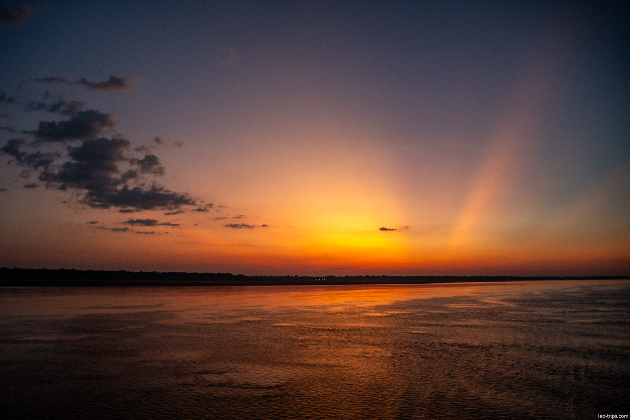 dramatic river sunset amazon river