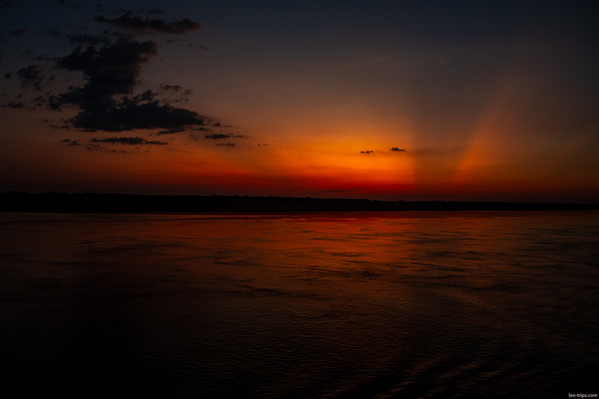orange and red sky sunset amazon river