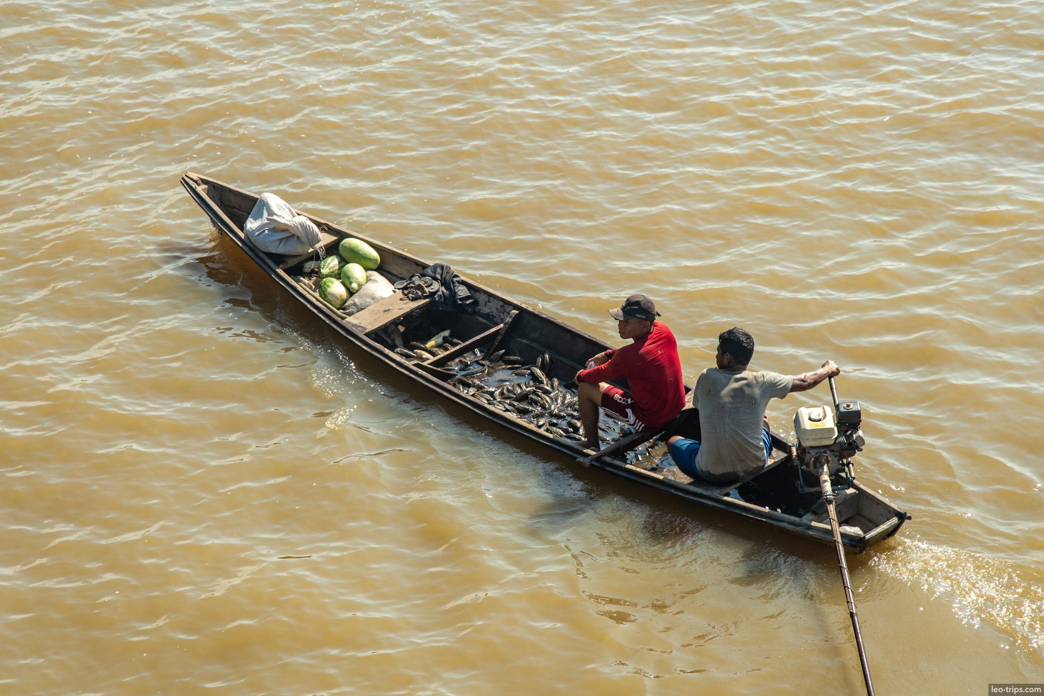 people in boat on river amazon river