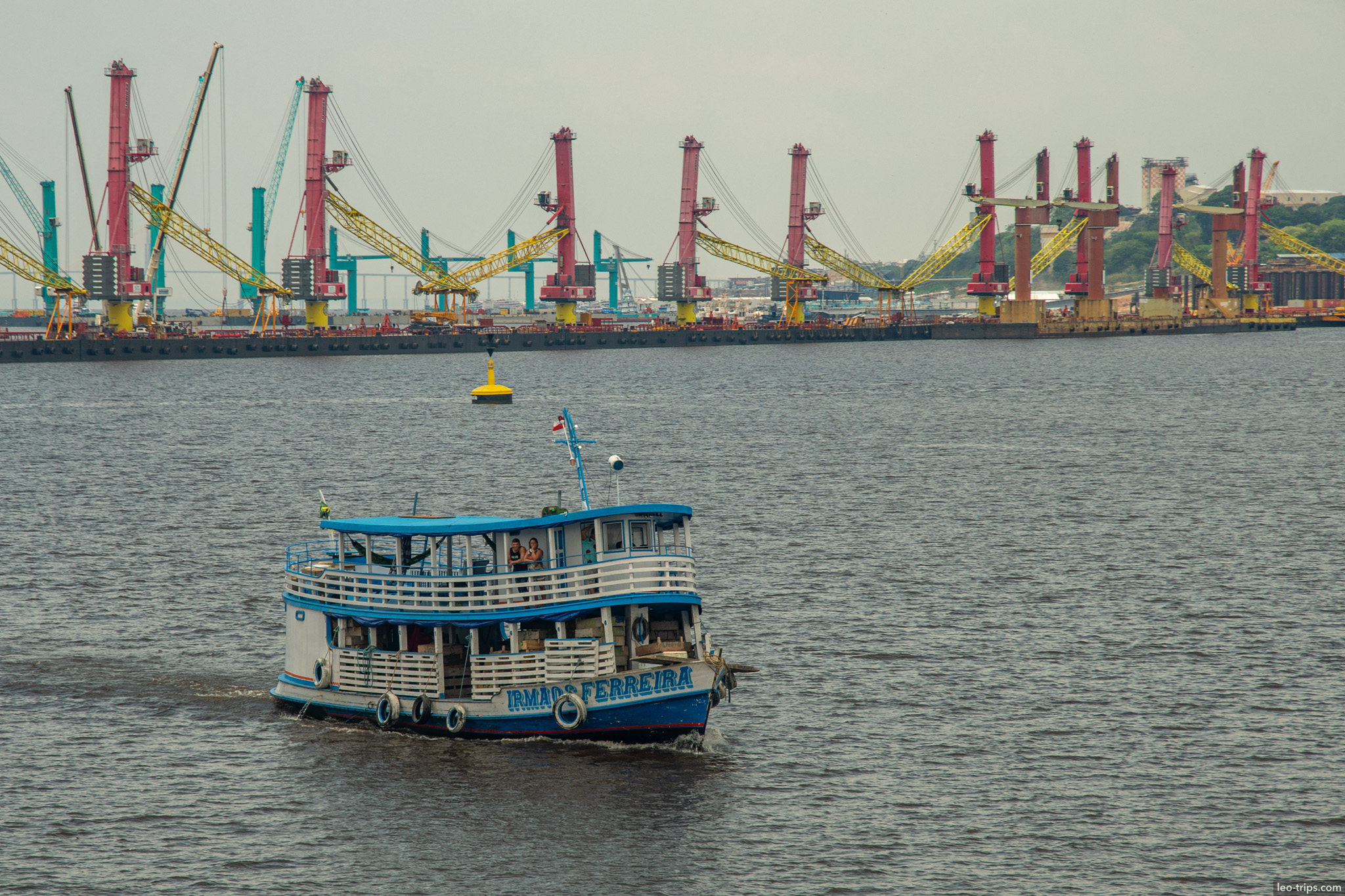 river vessel near cargo cranes amazon river