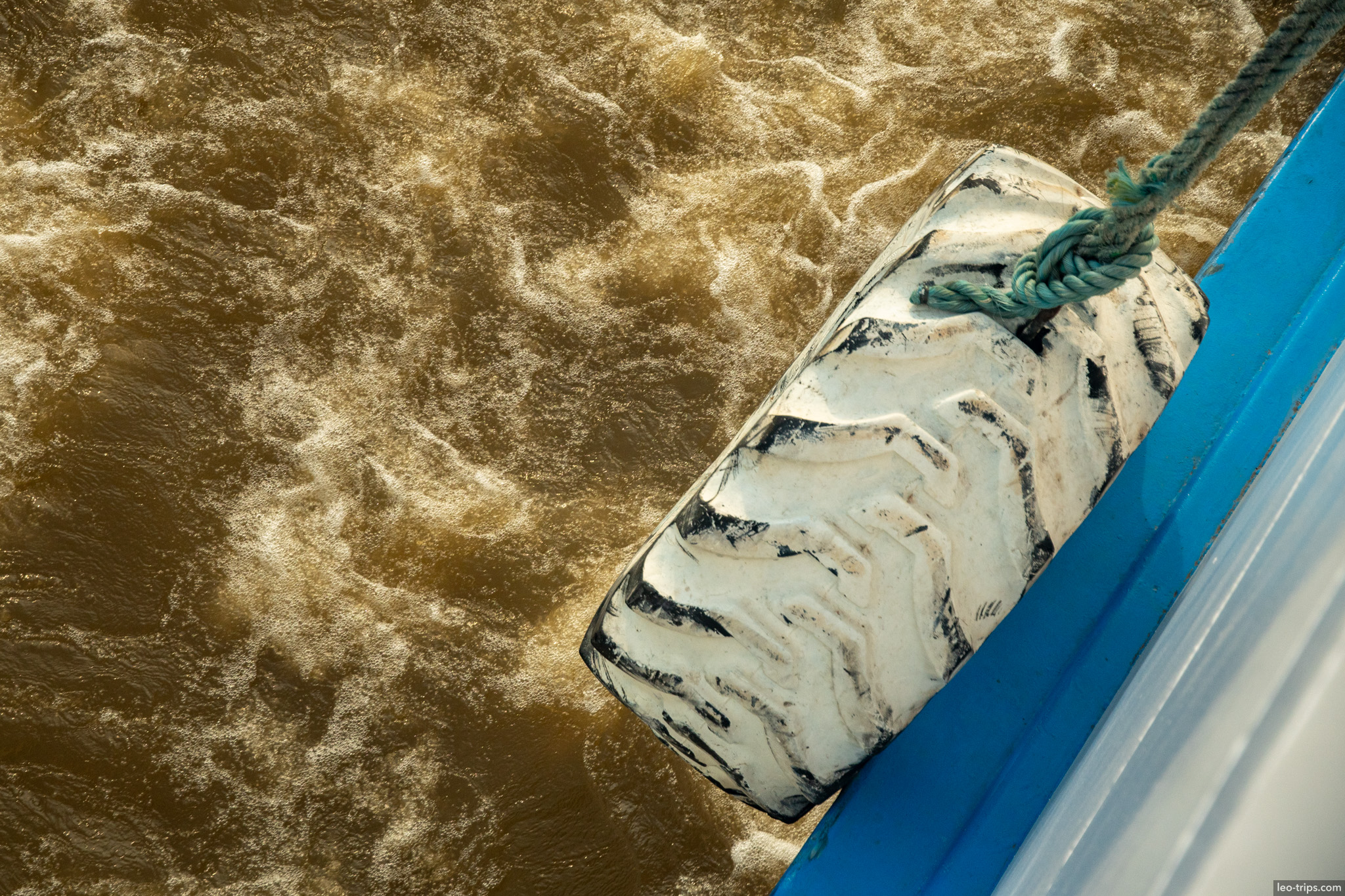 tires on boat amazon river