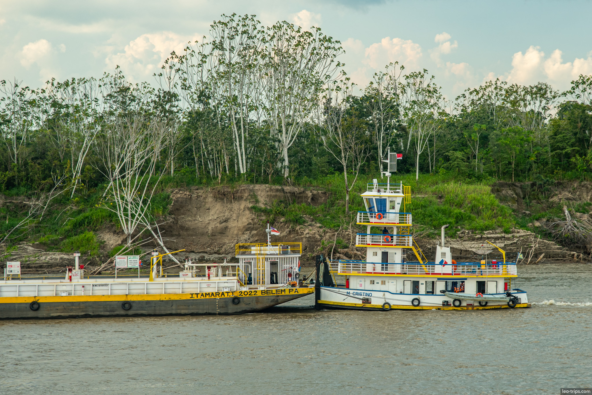 tugboat pushing barge amazon river