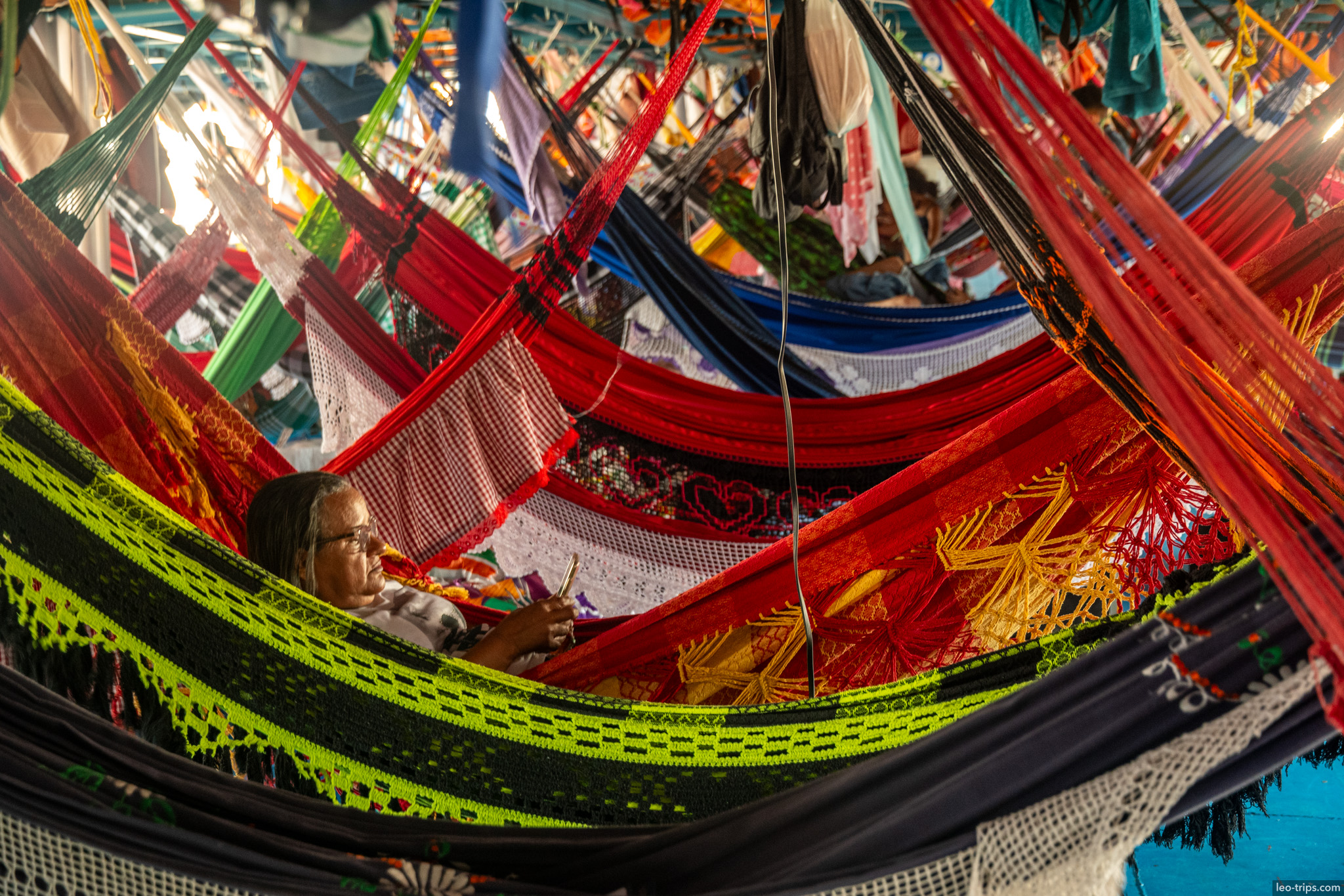 woman relaxing in hammock amazon river