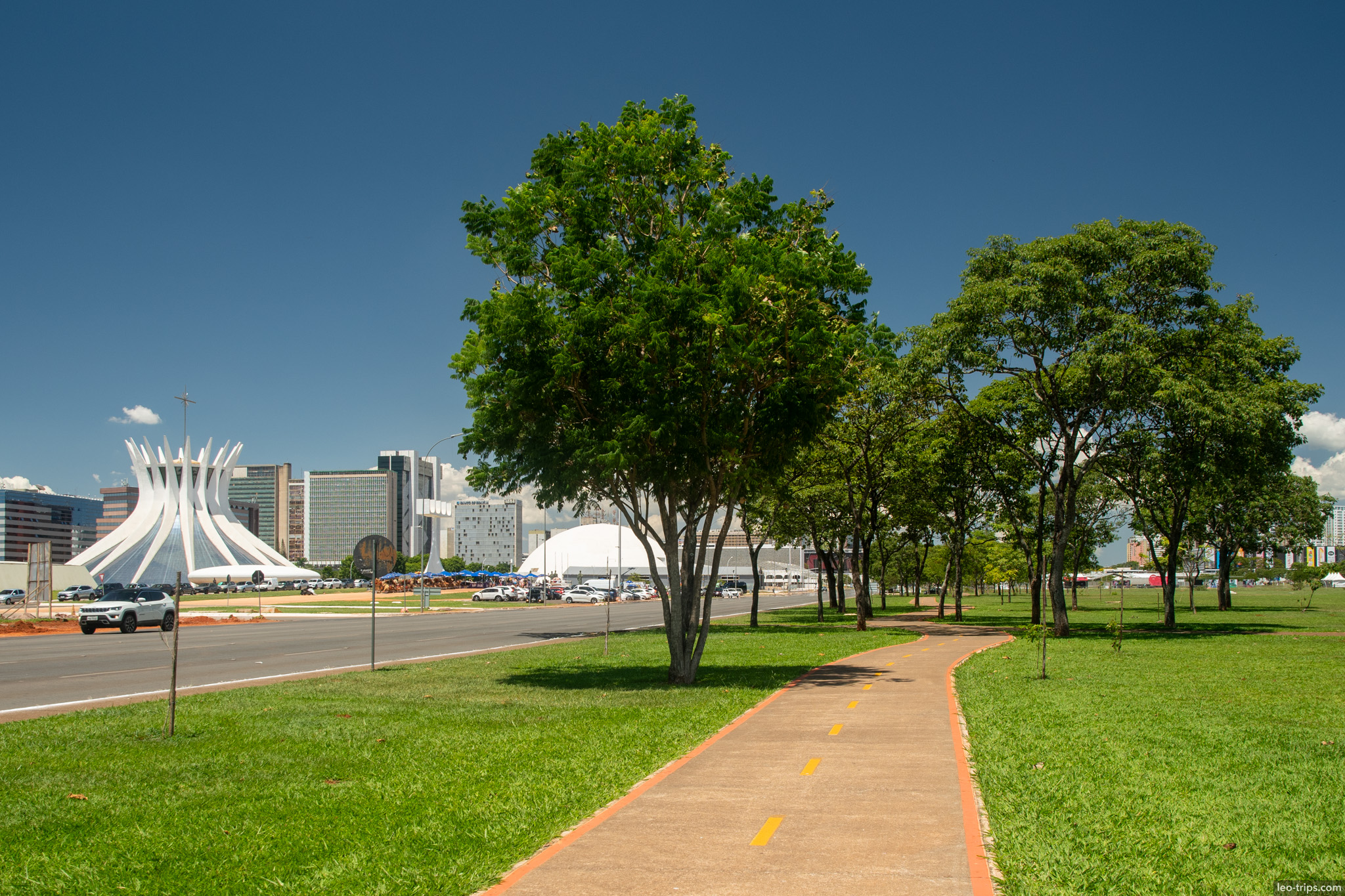 cycle path trees cathedral view esplanada brasilia