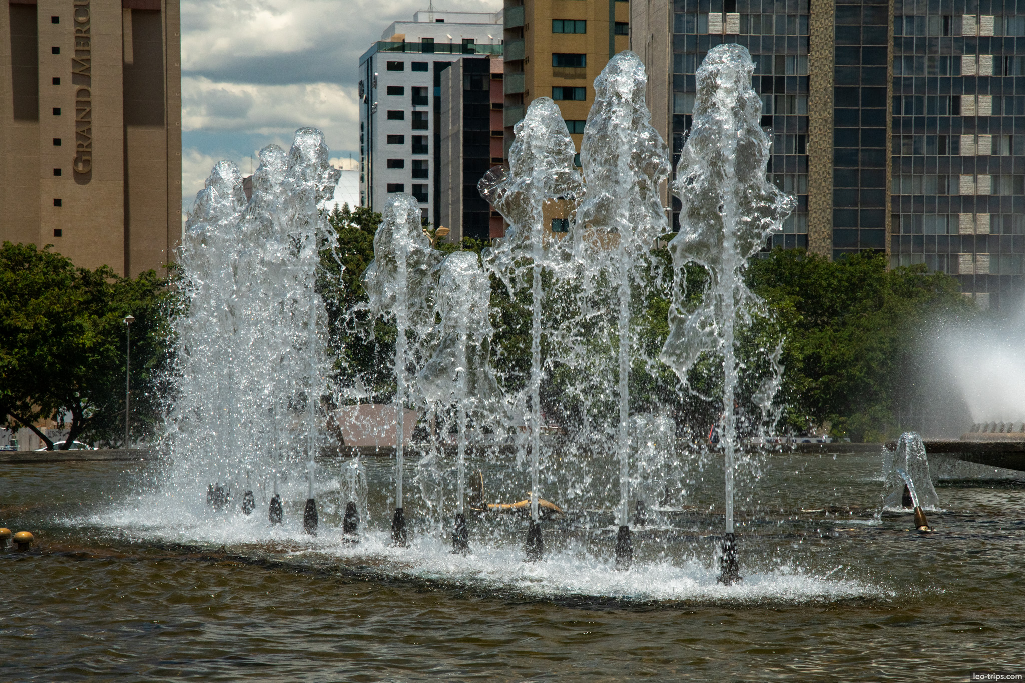 fountain water jets hotel buildings background brasilia
