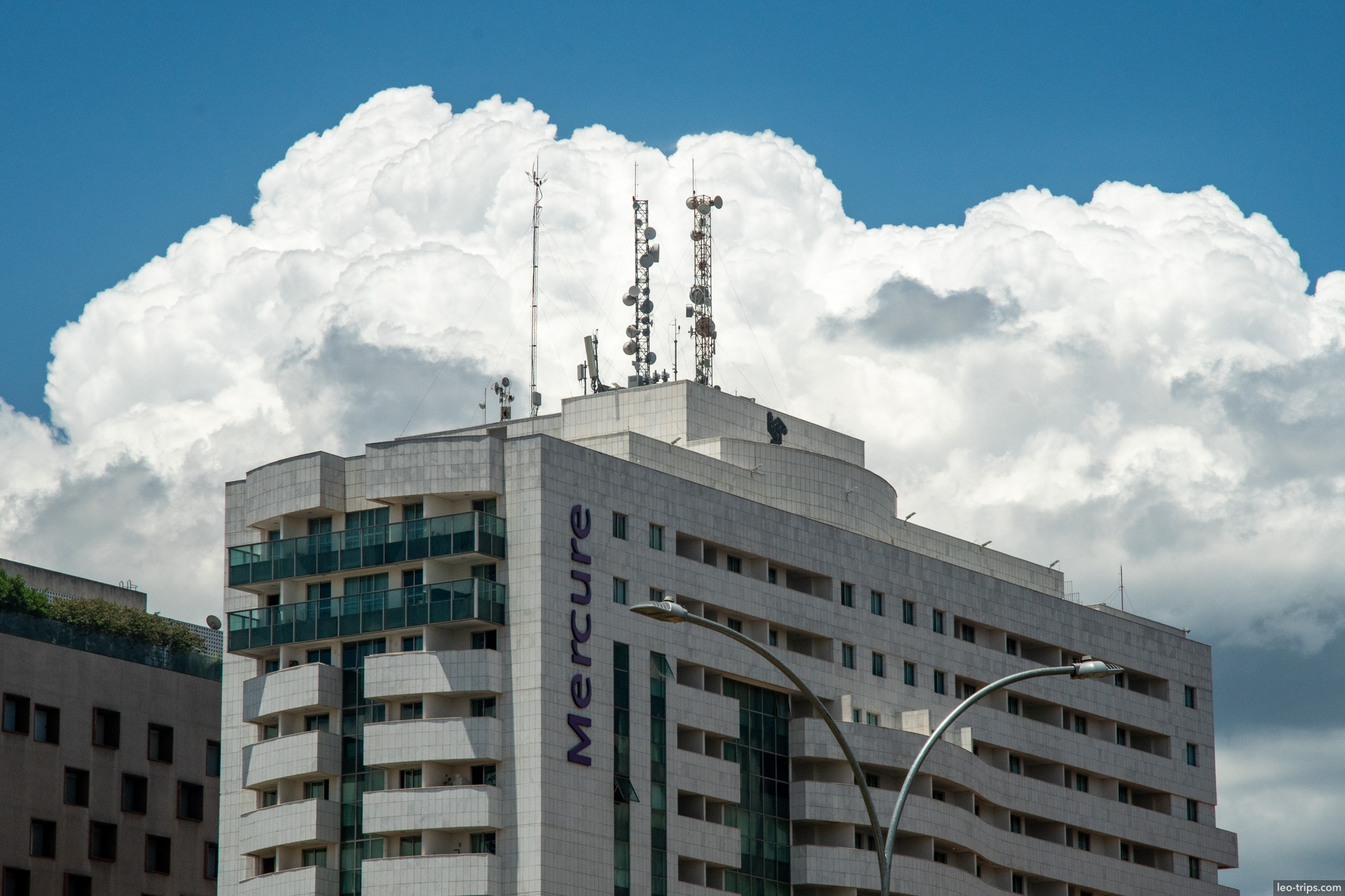 hotel tower against towering cumulus cloud brasilia