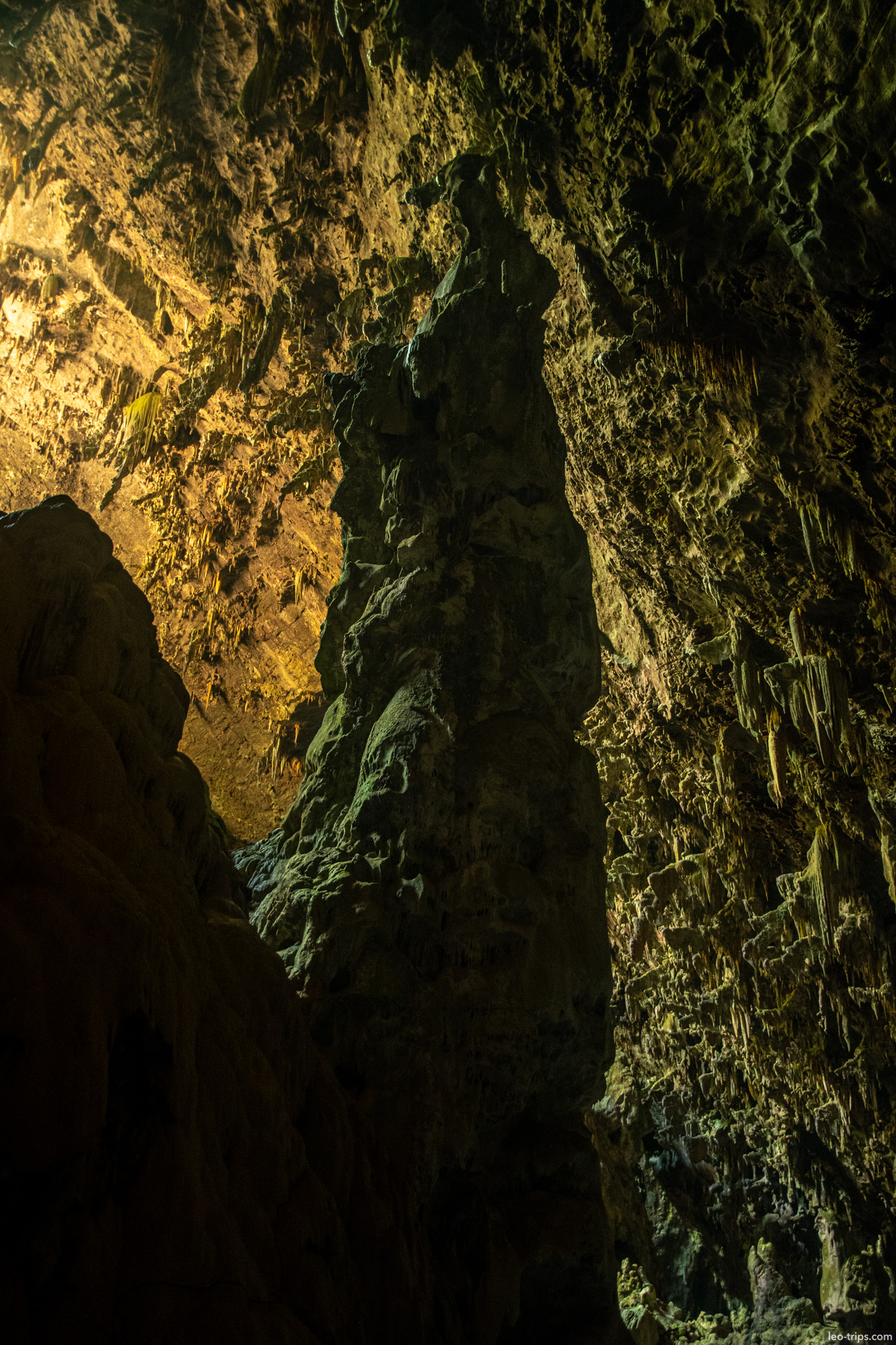 tall rock pillar in cave chamber gruta do lago azul gruta do lago azul
