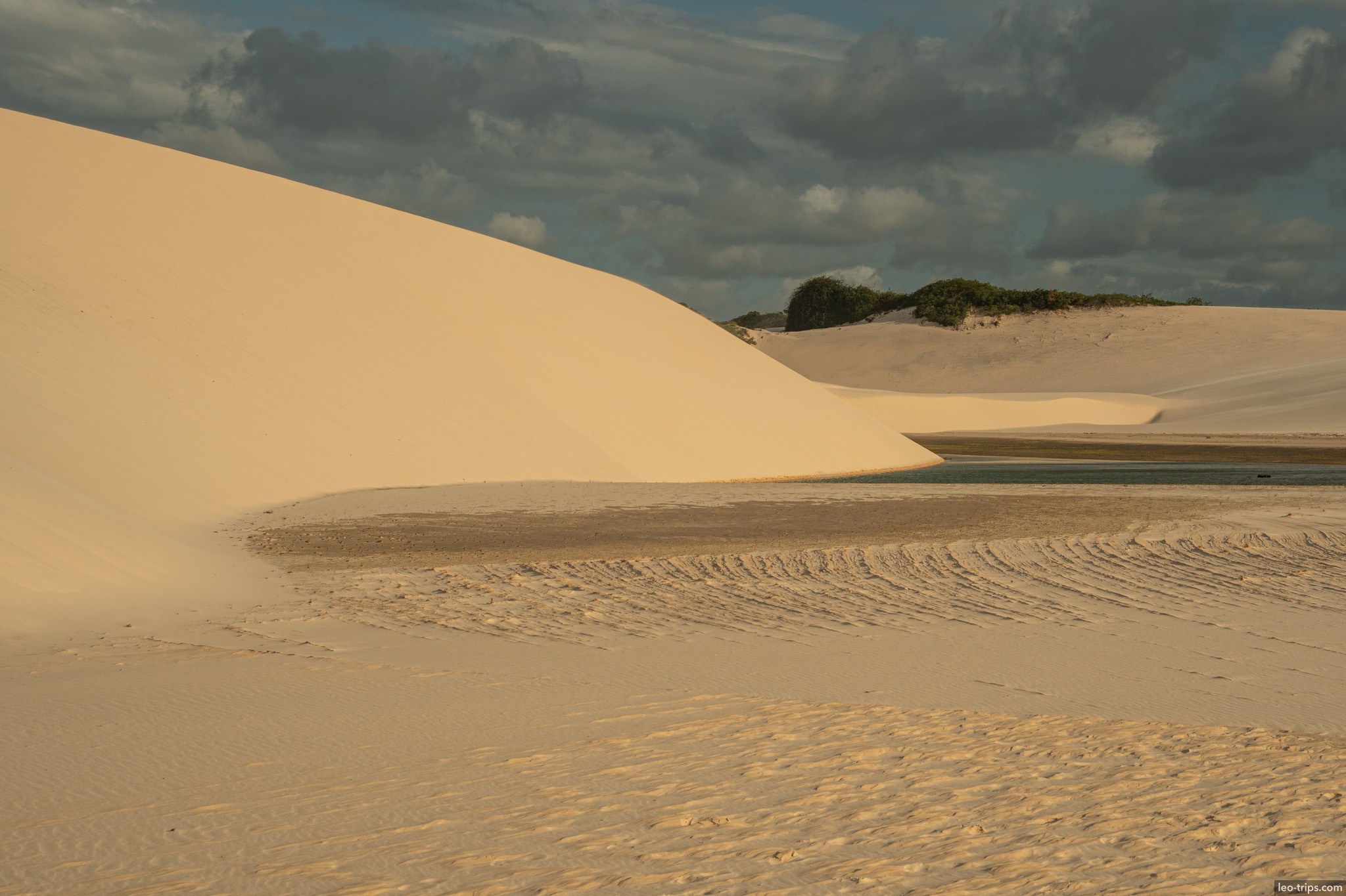 sand dune lagoon golden hour tire tracks lencois lencois maranhenses