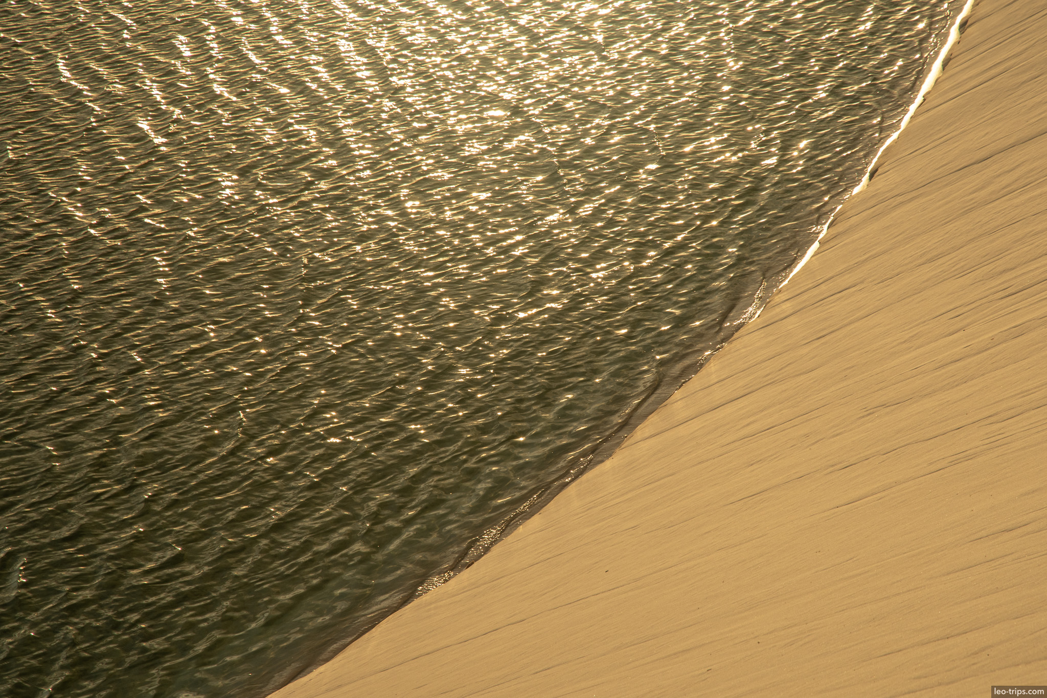 water meets sand golden light lencois lencois maranhenses