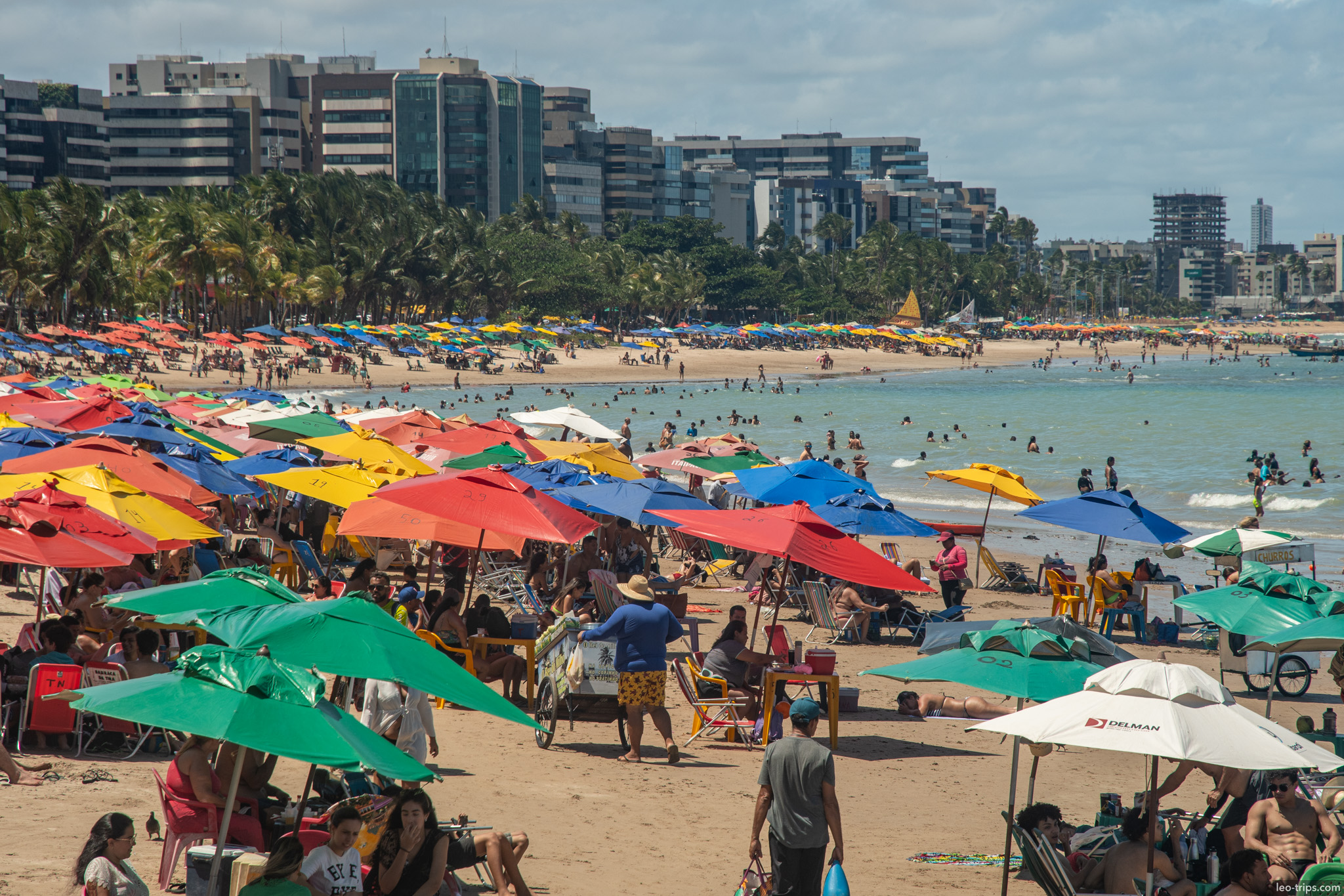 crowded maceio beach colorful umbrellas maceio
