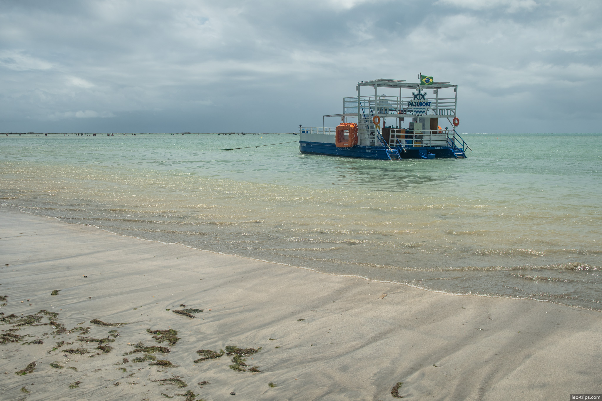 double decker tourist boat anchored off beach maceio