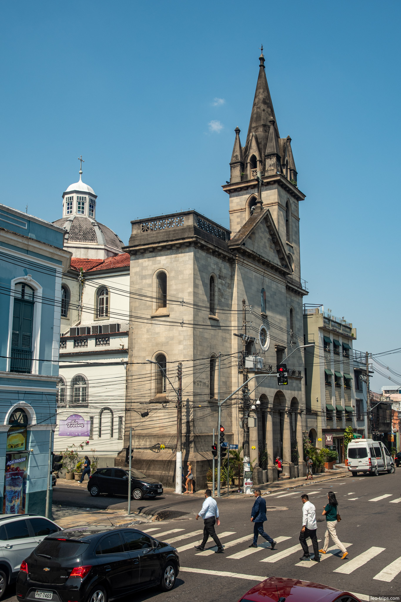 A street view of the side façade of the Church of São Sebastião, showing the busy daily life in the center of Manaus