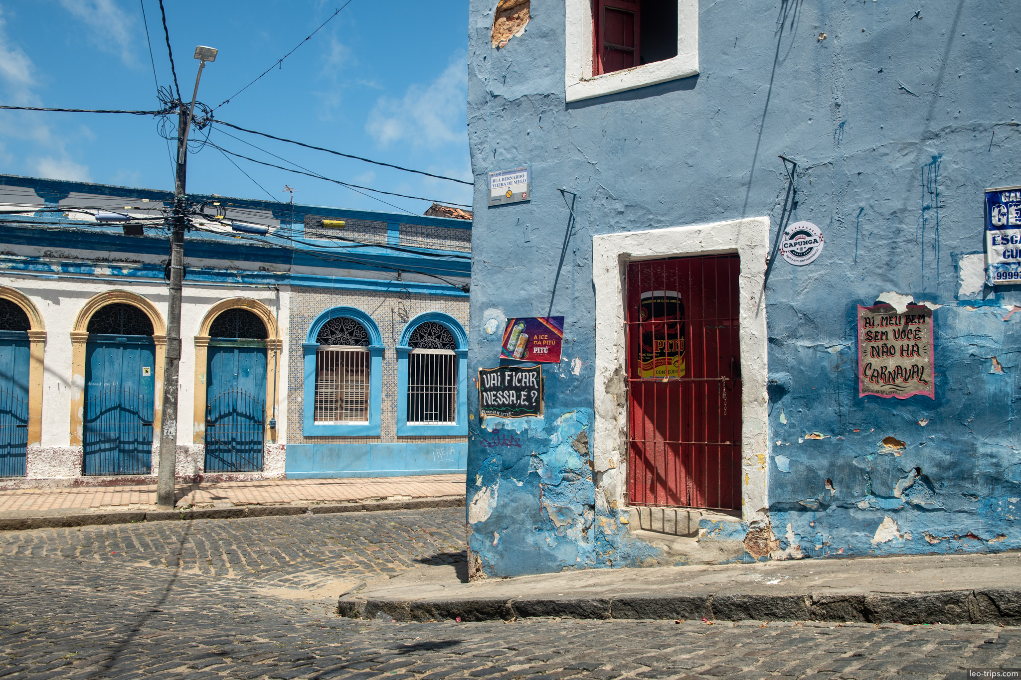 blue peeling colonial corner building cobblestone olinda olinda