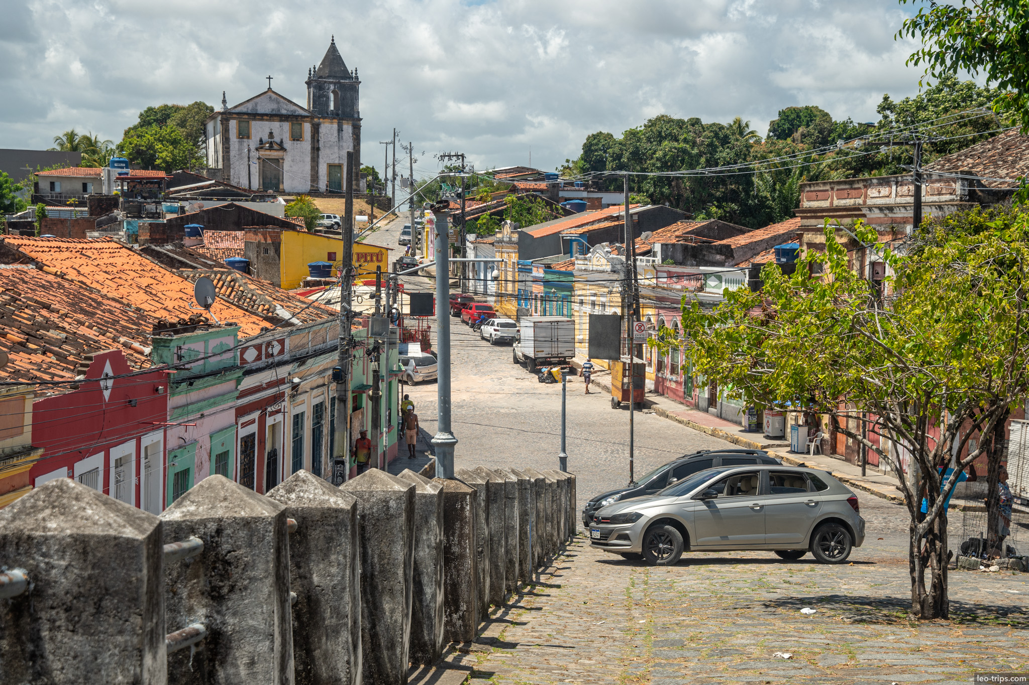cobblestone street colonial church tower background olinda olinda
