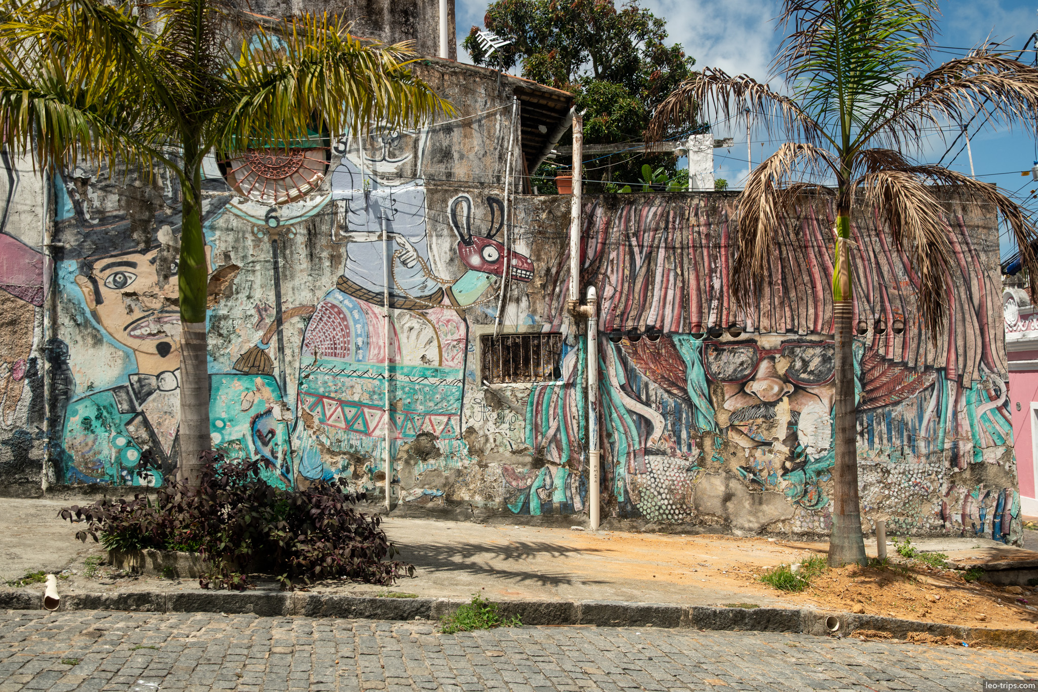 faded carnival mural folk characters palm trees olinda olinda