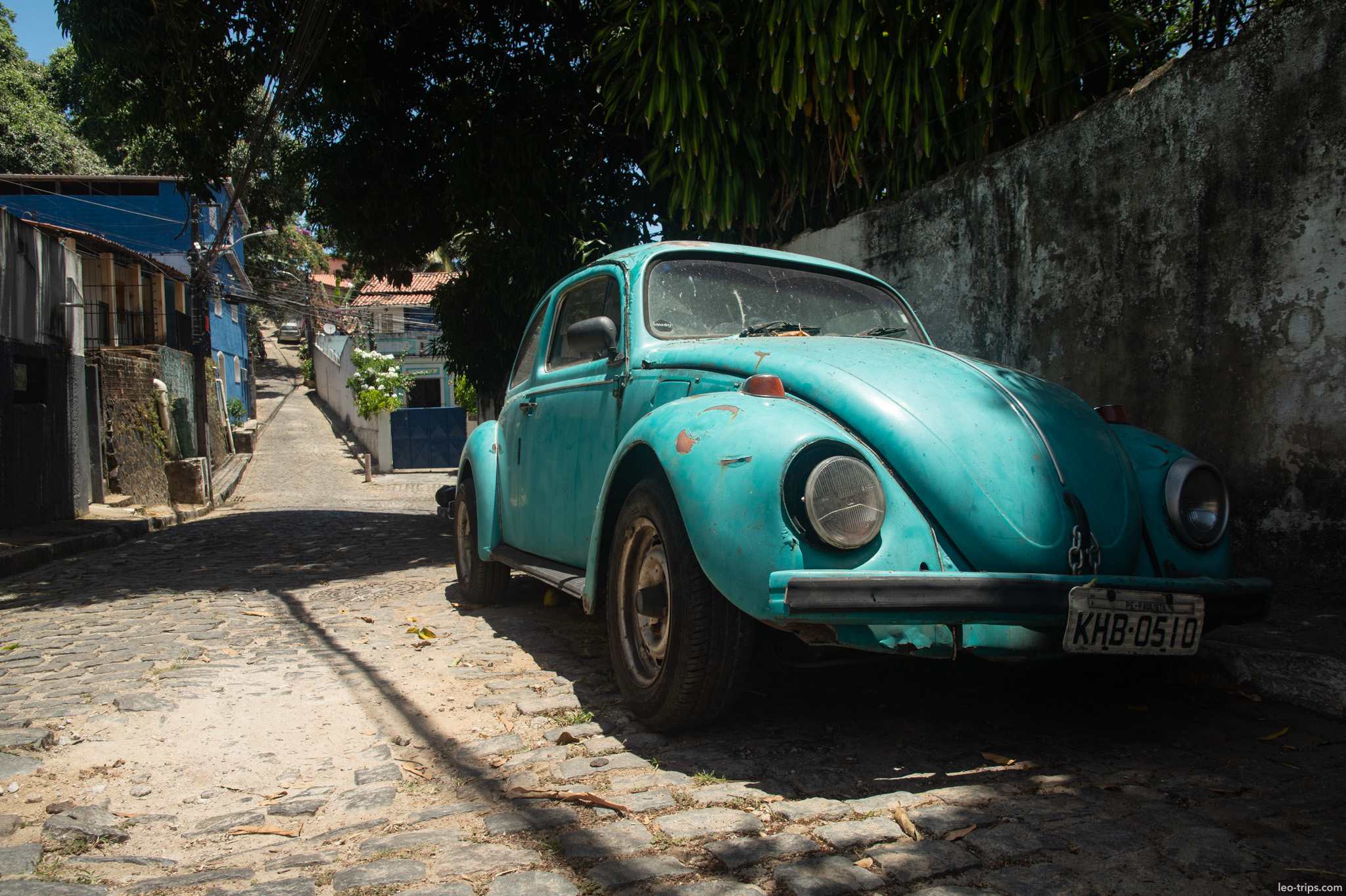 vintage turquoise volkswagen beetle on cobblestone lane olinda olinda