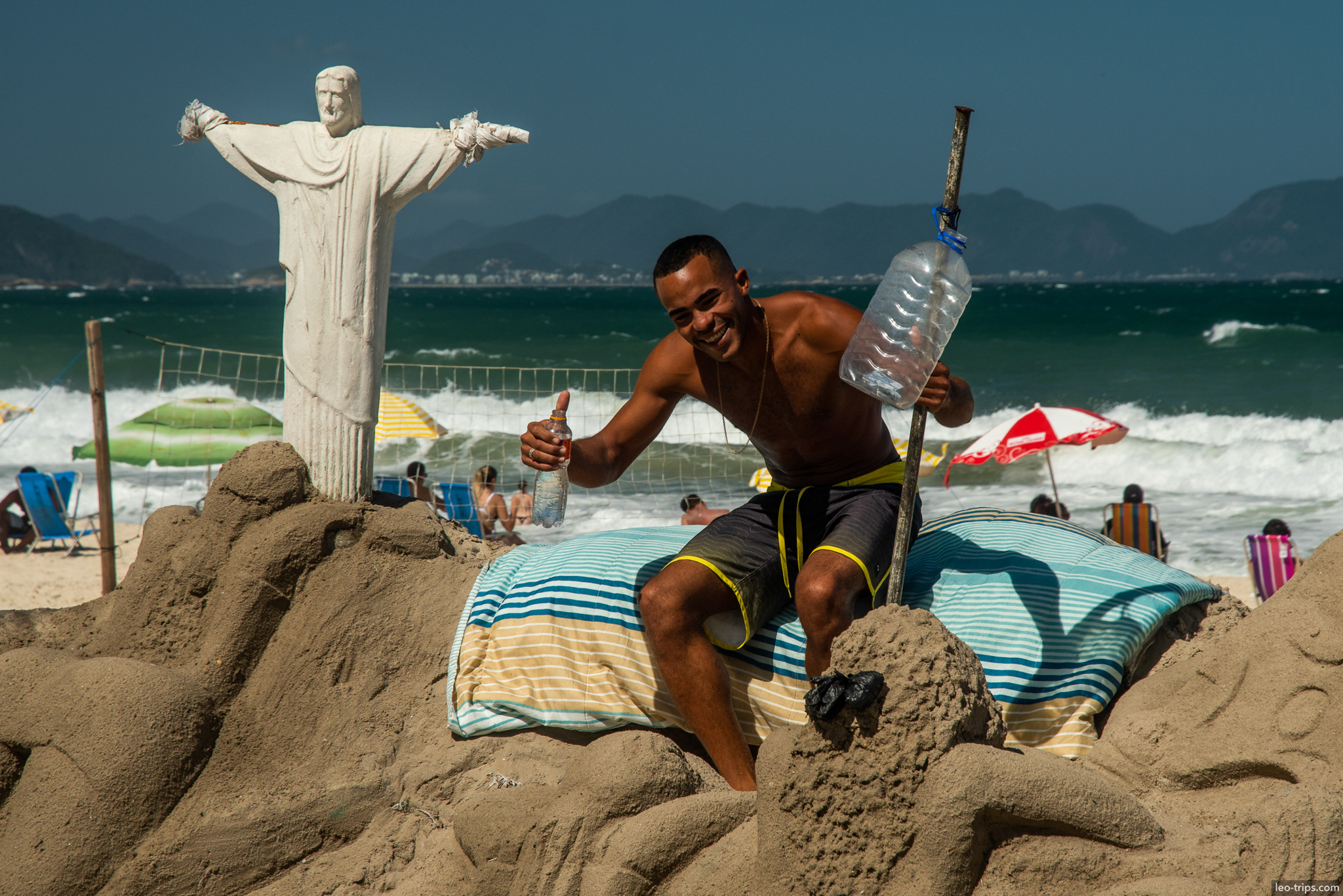 copacabana beach sand sculpture christ redeemer rio de janeiro