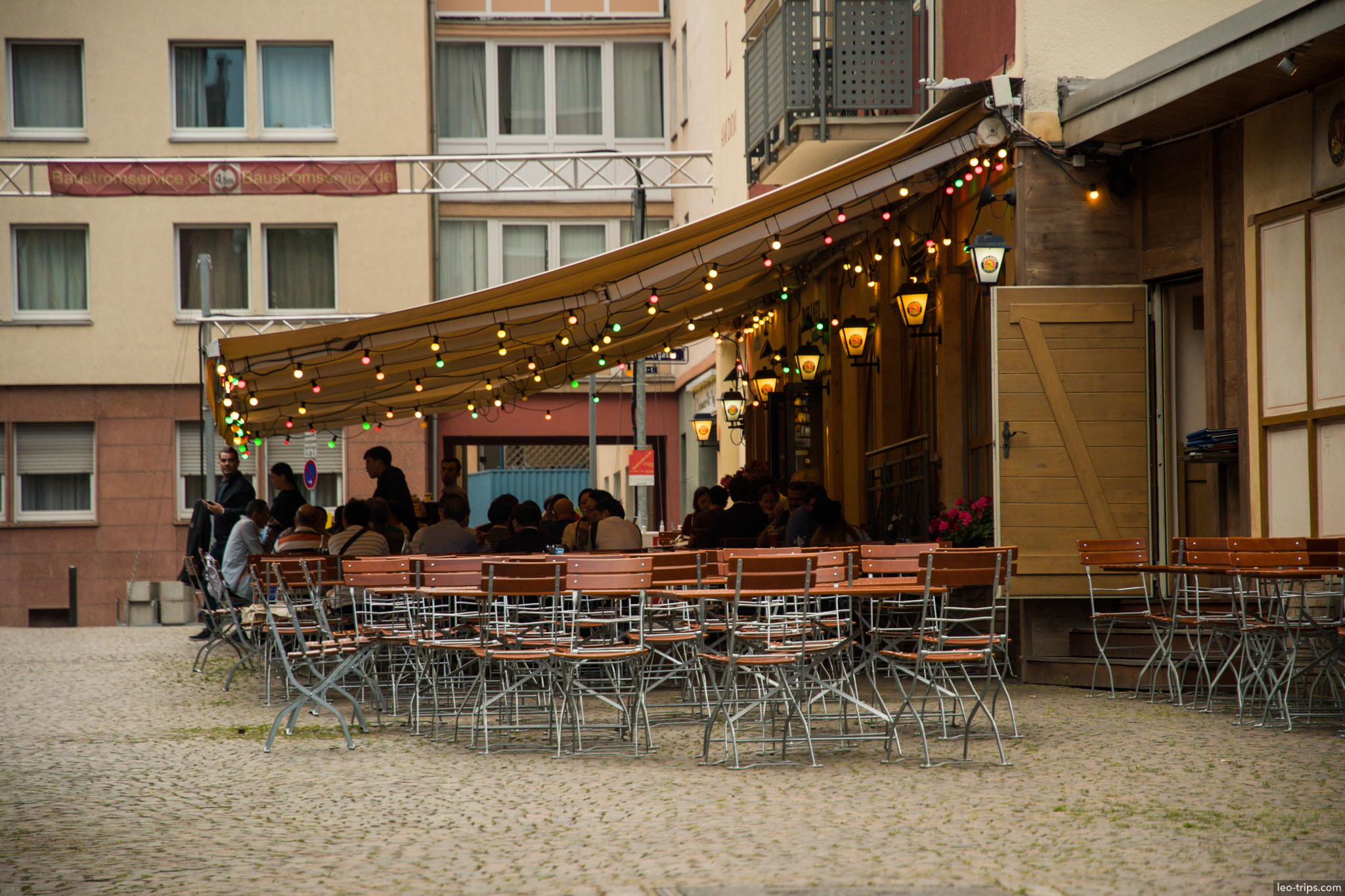 outdoor cafe evening string lights sachsenhausen frankfurt
