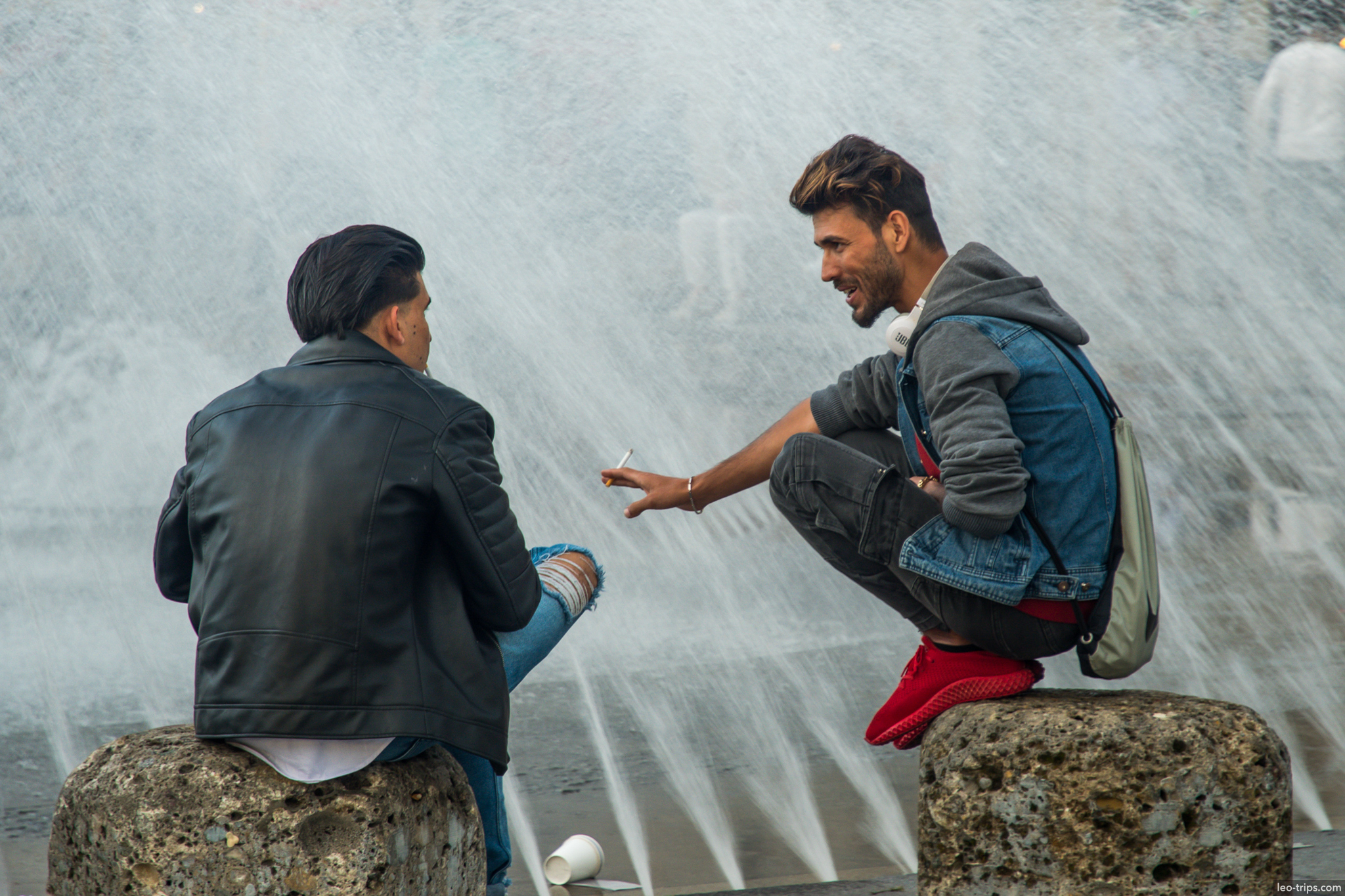 two men talking fountain munich munich
