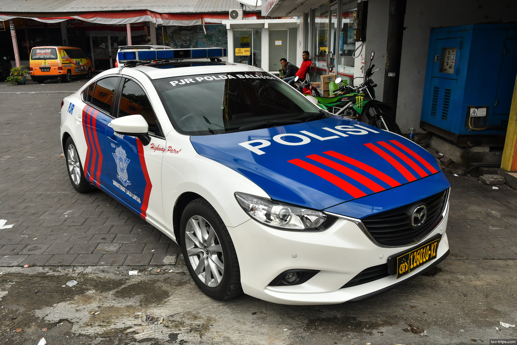 blue and white highway patrol police car bali