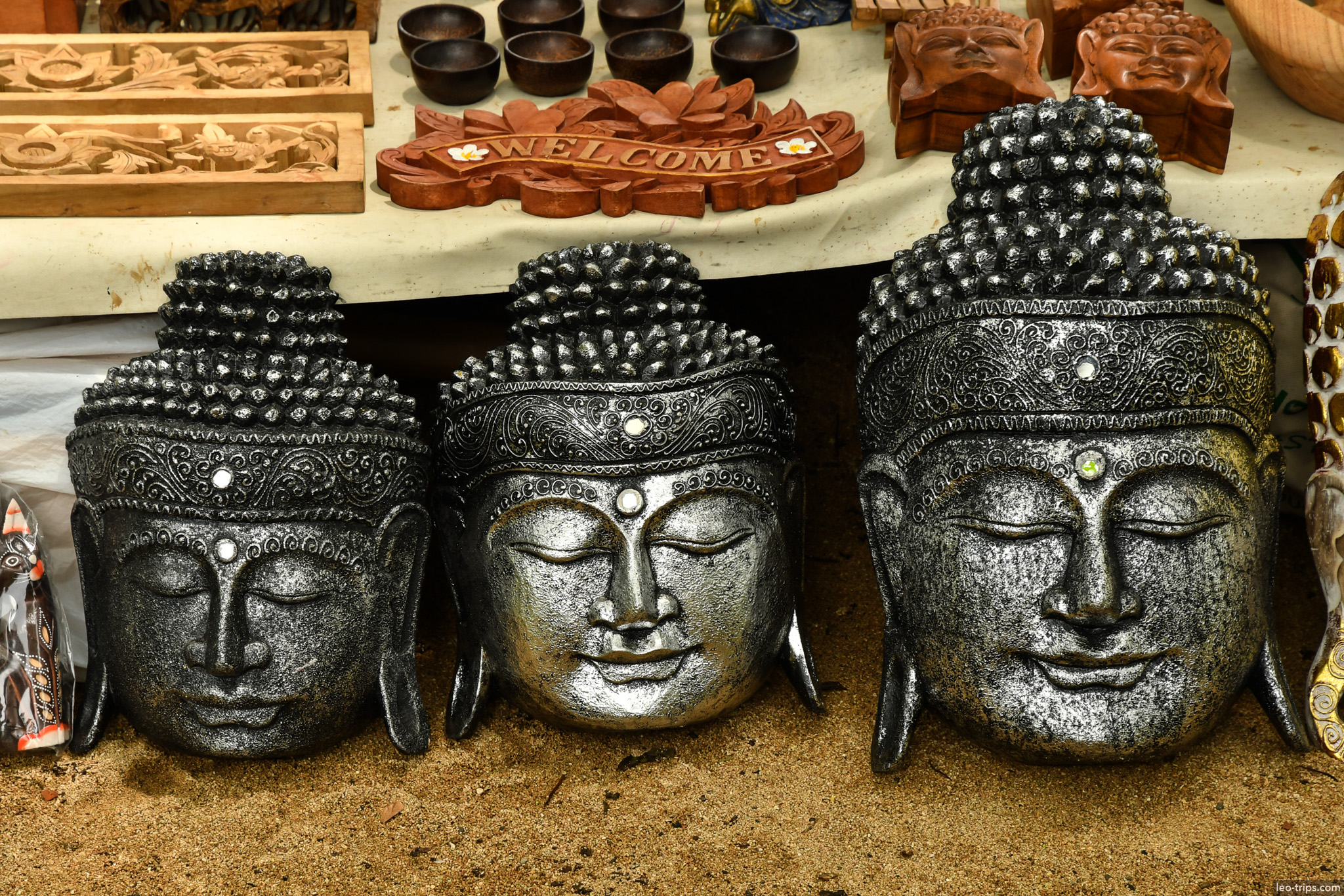 buddha head wood carvings souvenir shop bali