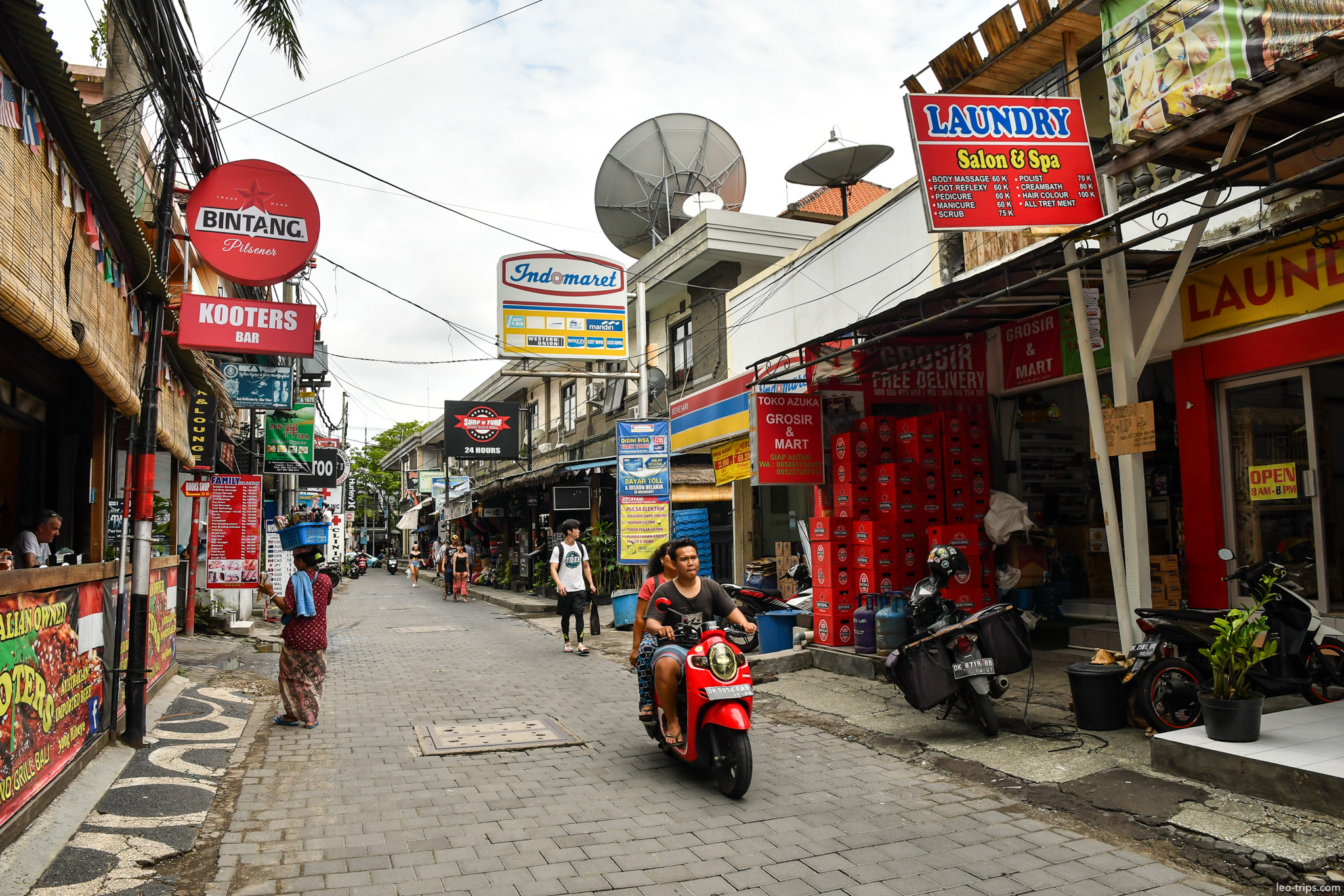 busy narrow street shops and scooter kuta bali