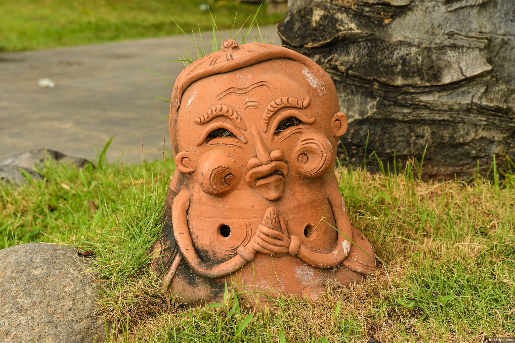 terracotta garden sculpture comic face bali