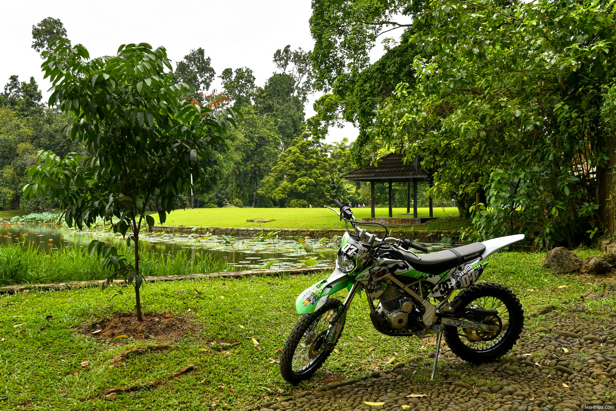 motocross bike parked by pond bogor botanical garden bogor