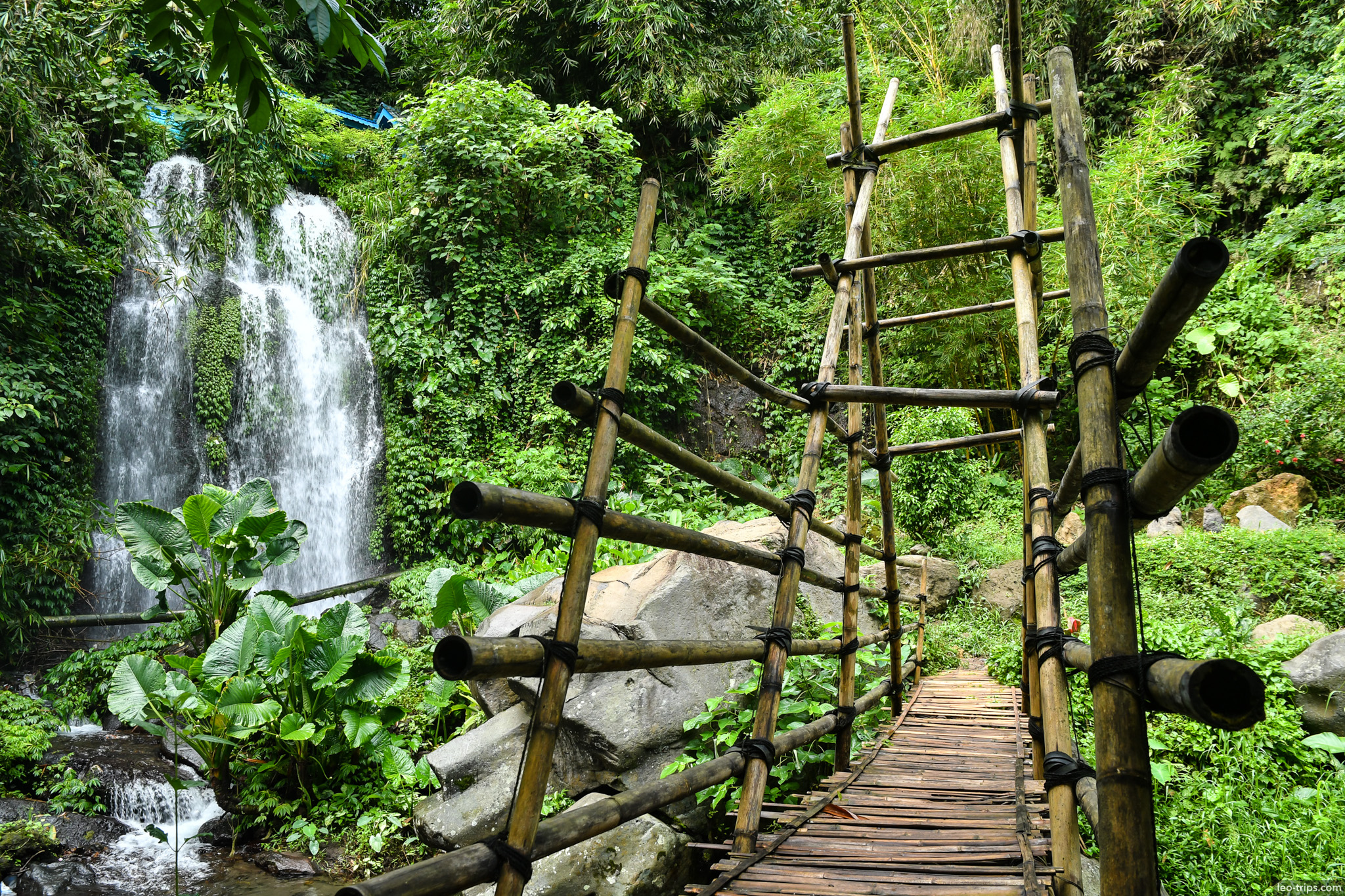 bamboo bridge leading to waterfall ijen ijen lake