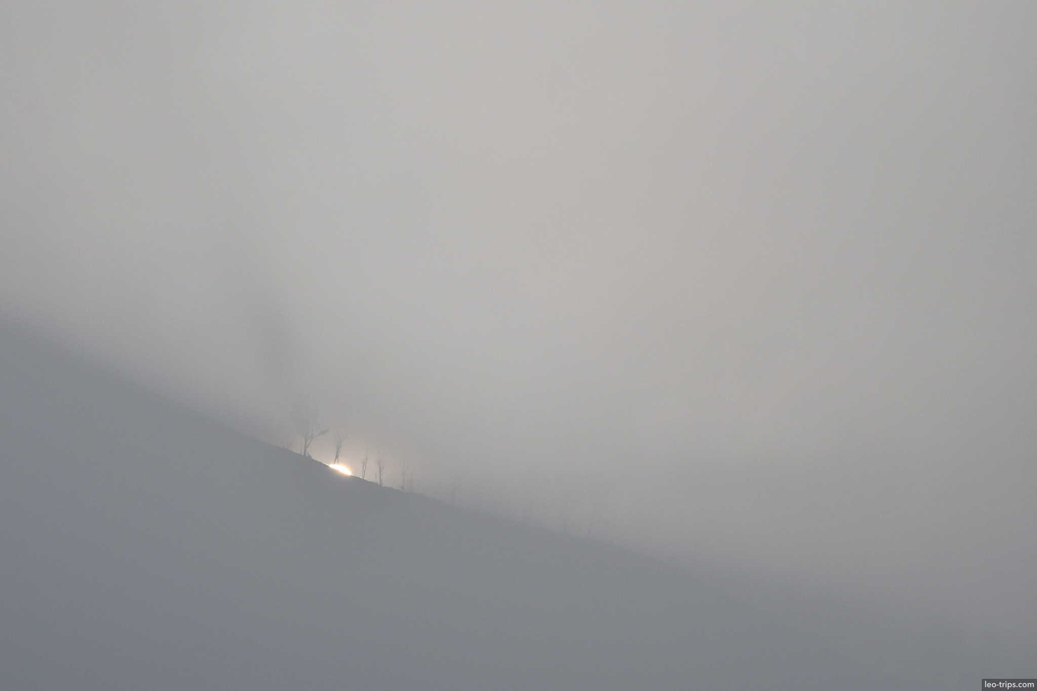 distant ridge in thick volcanic haze ijen ijen lake