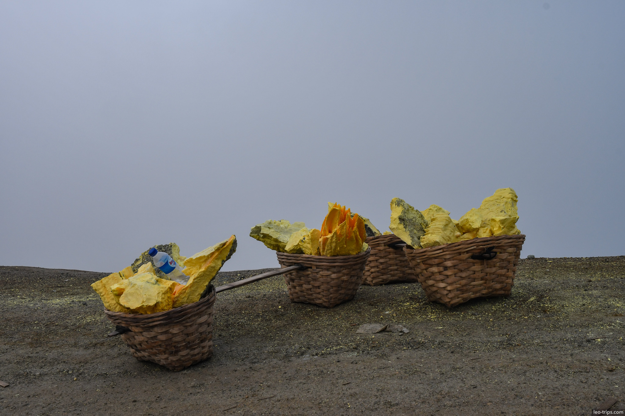 four woven baskets full of sulfur chunks ijen ijen lake
